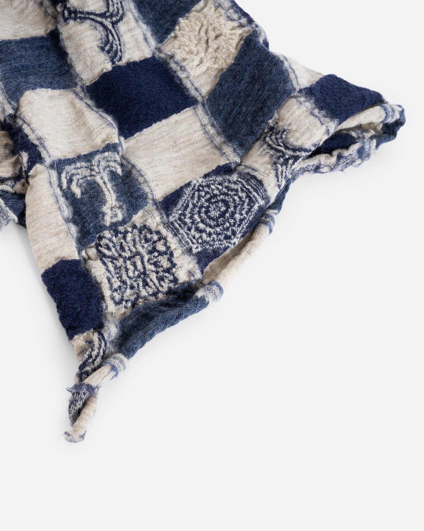 A grey and navy blue checkered scarf with a nautical print. Shown close up.