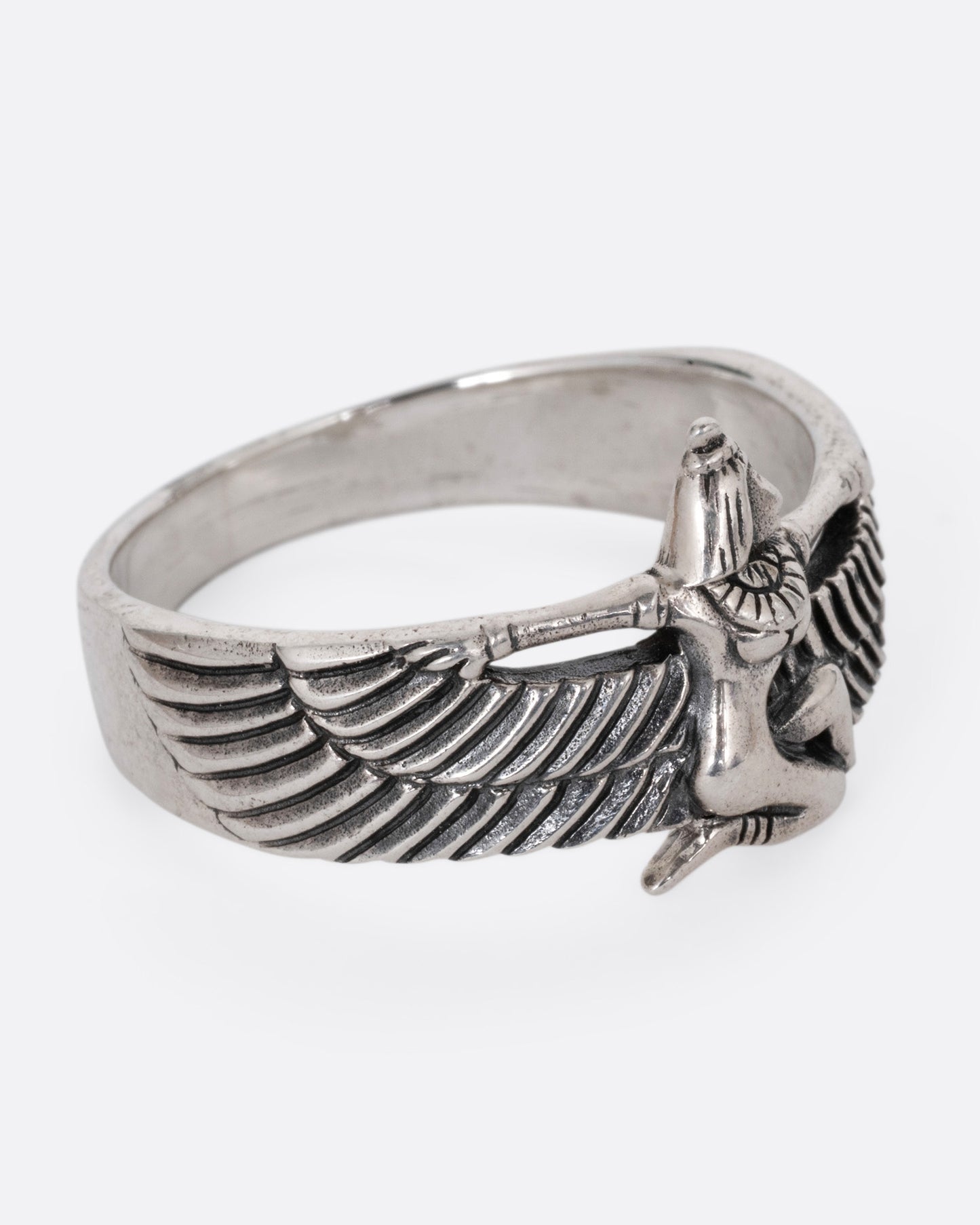 A silver ring with Isis, the ancient Egyptian goddess and powerful magician spreading her wings. Shown from the side.