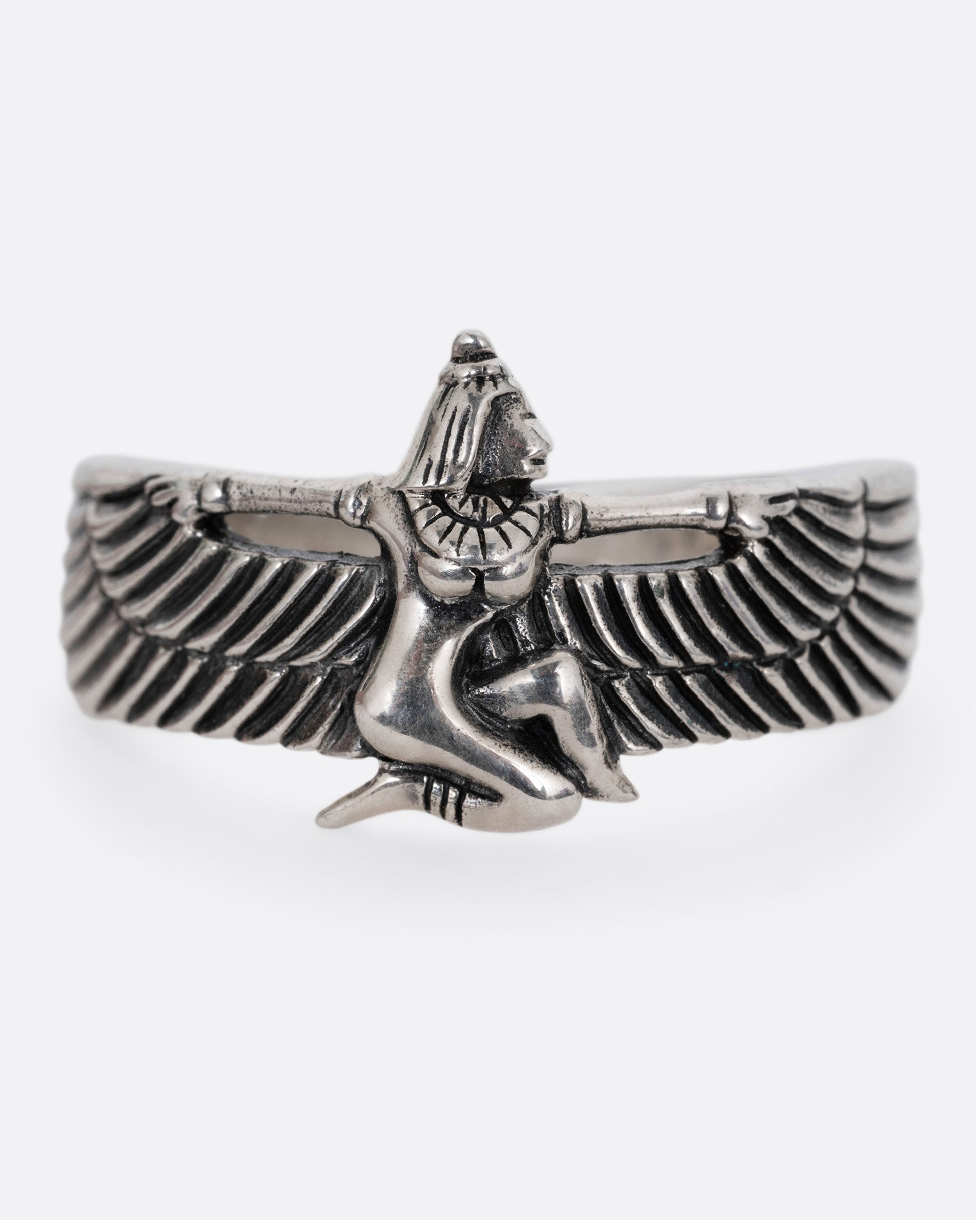 A silver ring with Isis, the ancient Egyptian goddess and powerful magician spreading her wings. Shown from the front.
