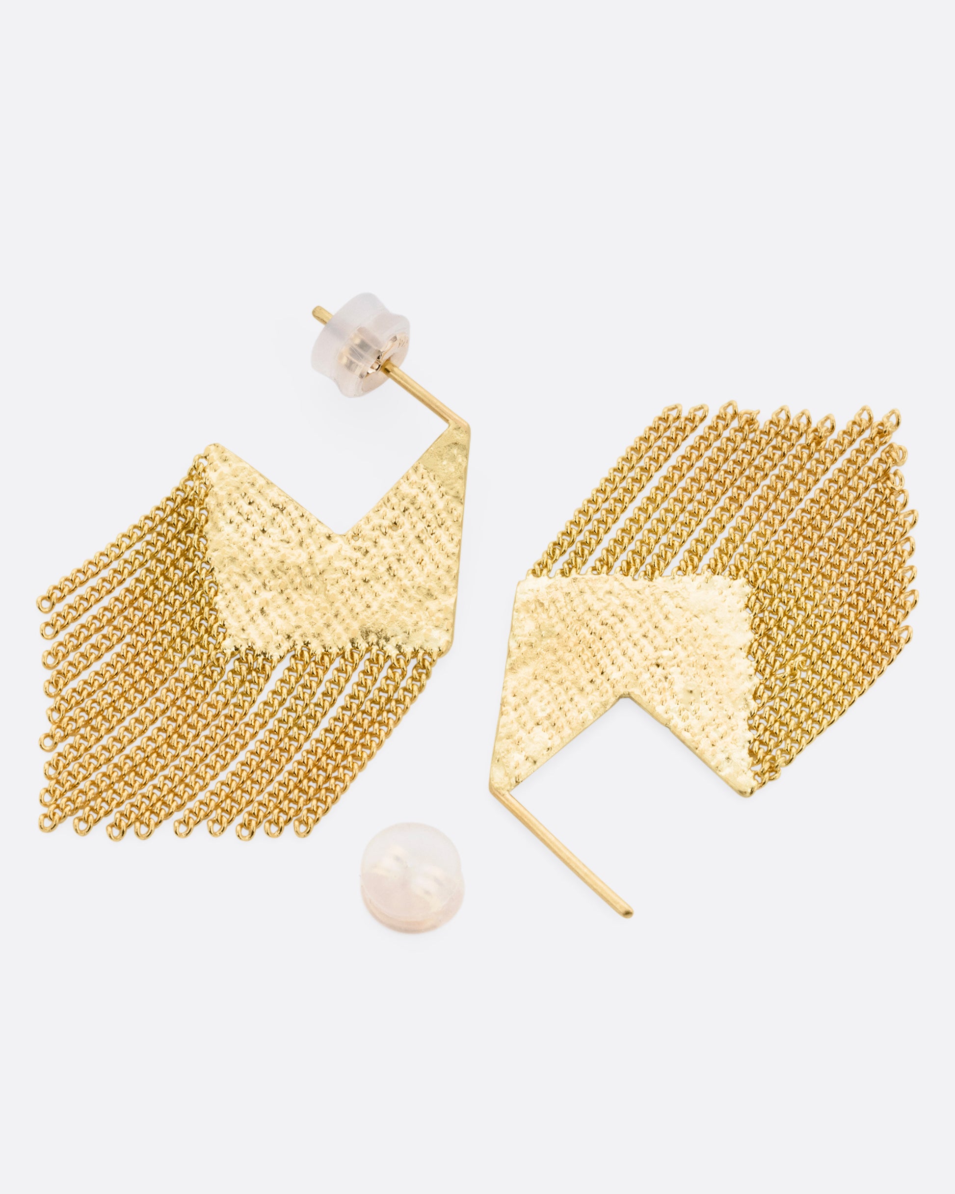 A pair of yellow gold stud back angular earrings with fine cable chain fringe, shown from the side with one earring open.