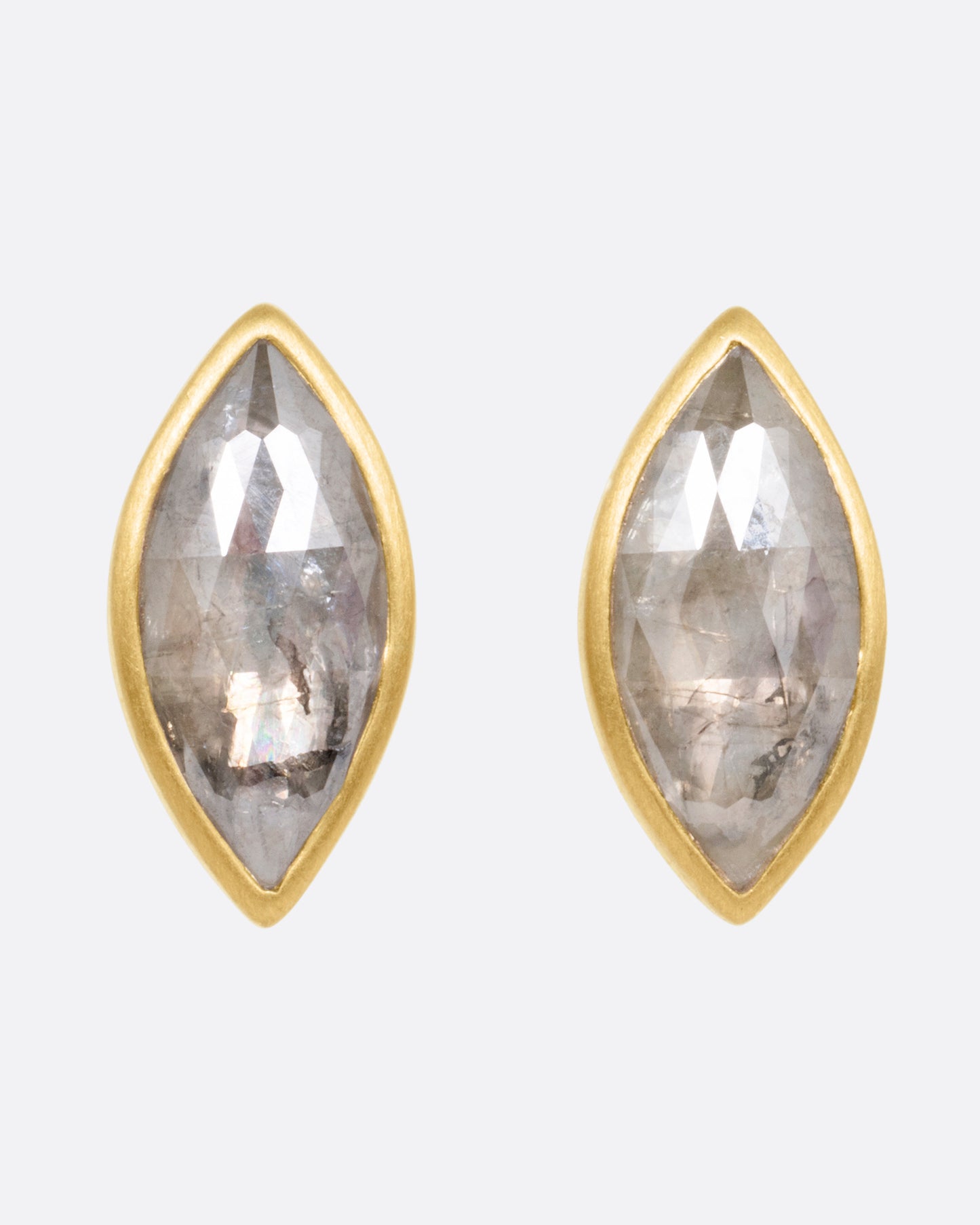 A pair of yellow gold navette diamond earrings, shown from the front.