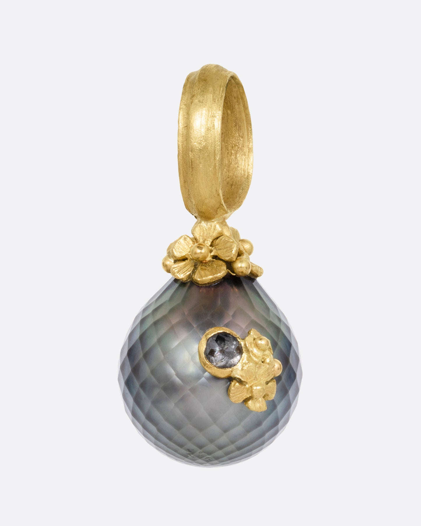 A yellow gold textured Tahitian pearl pendant with diamond accented flowers. Shown from the front.