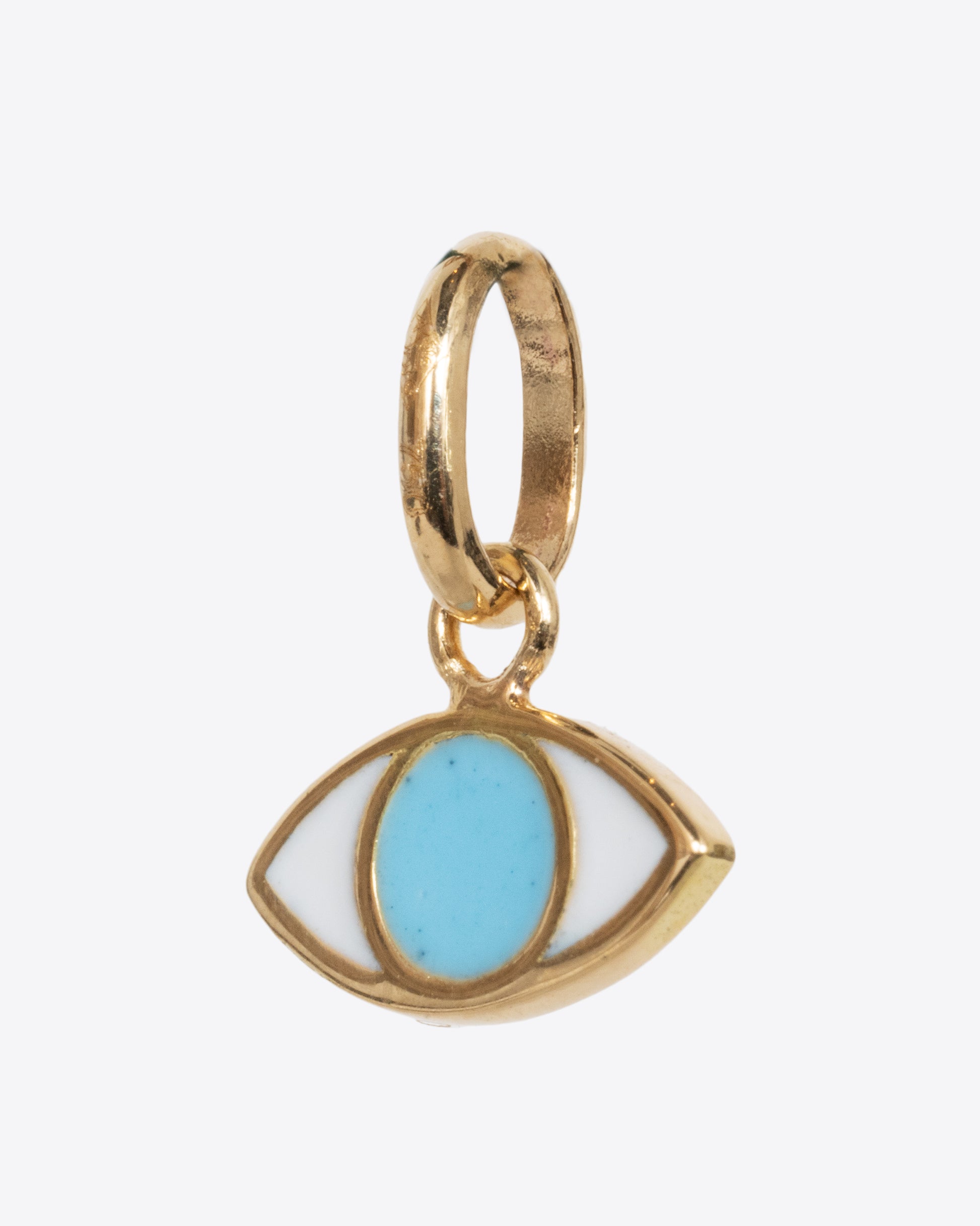 A yellow gold eye charm with turquoise blue and white. Shown from the side.