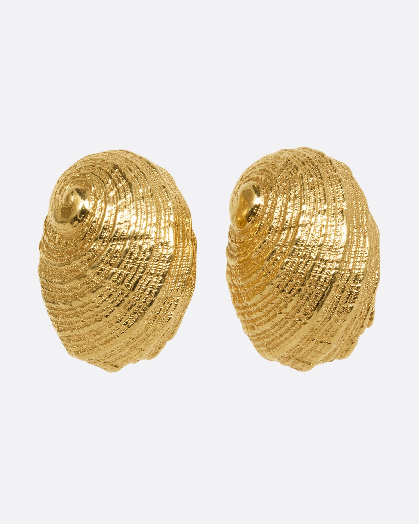 A pair of yellow gold earrings in the shape of a shell. Shown from the front.