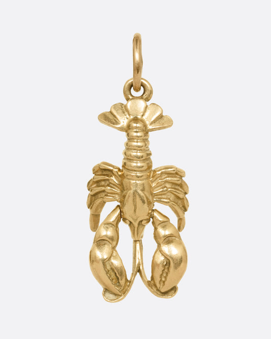 A yellow gold lobster charm, shown from the front.