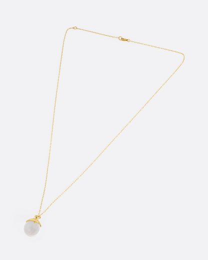 Yellow gold quartz sphere pendant necklace laid flat, showing the chain length and clasp
