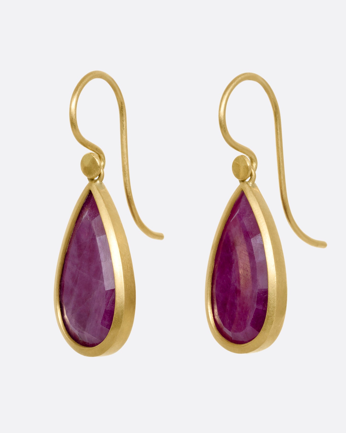 yellow gold ruby crystal earrings shown from the side