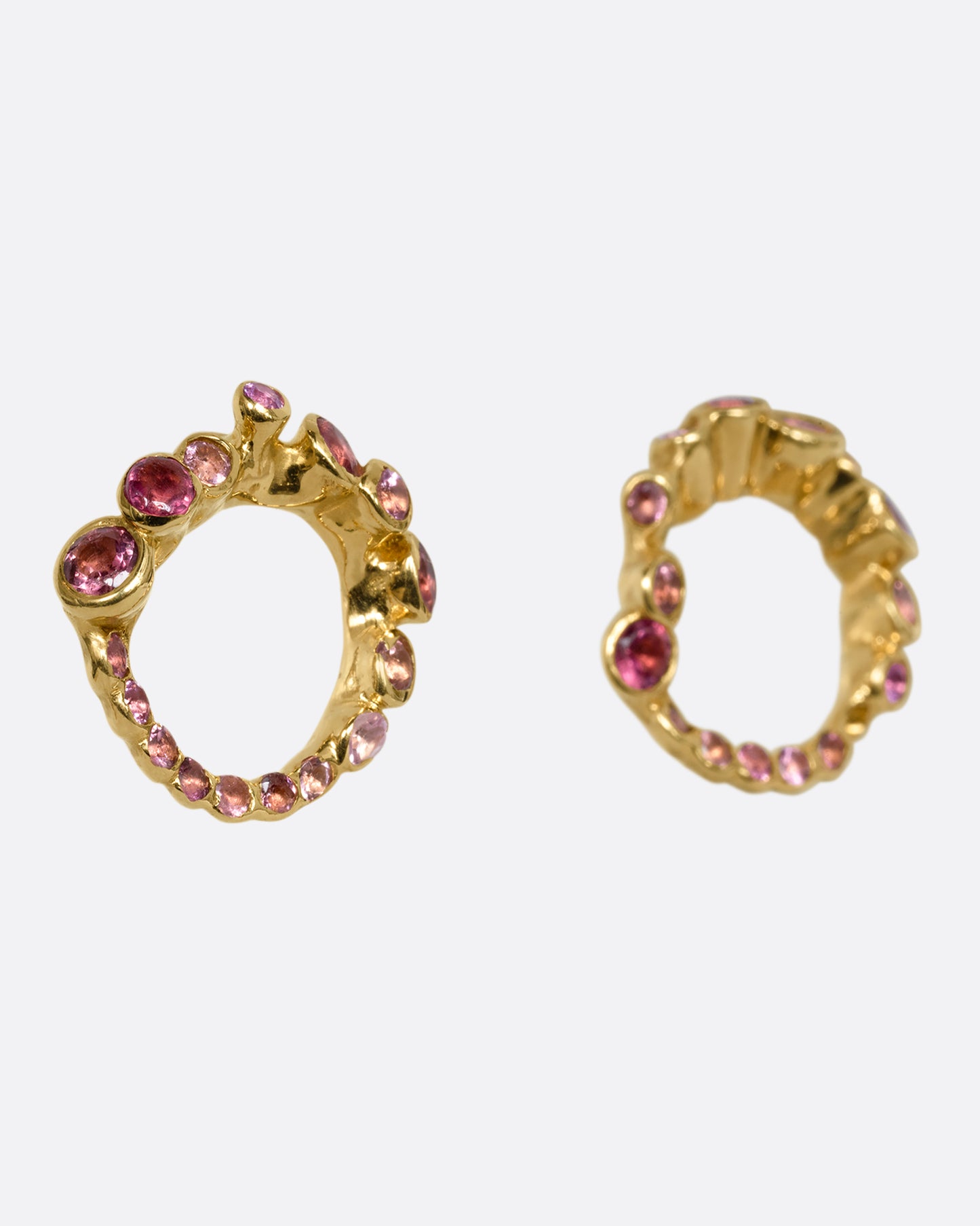 yellow gold earrings with pink and red tourmalines shown from the side