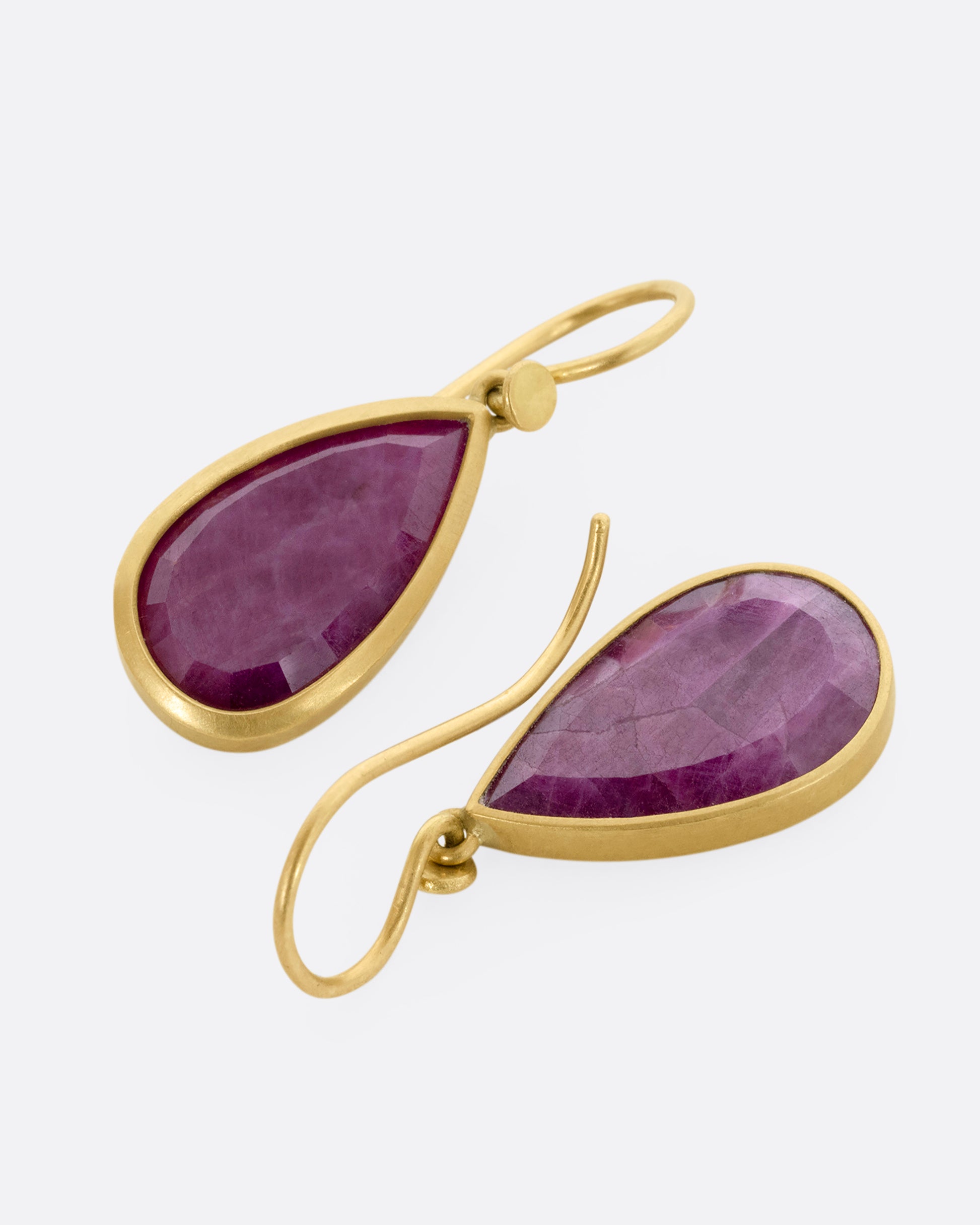 yellow gold ruby crystal earrings shown lying flat