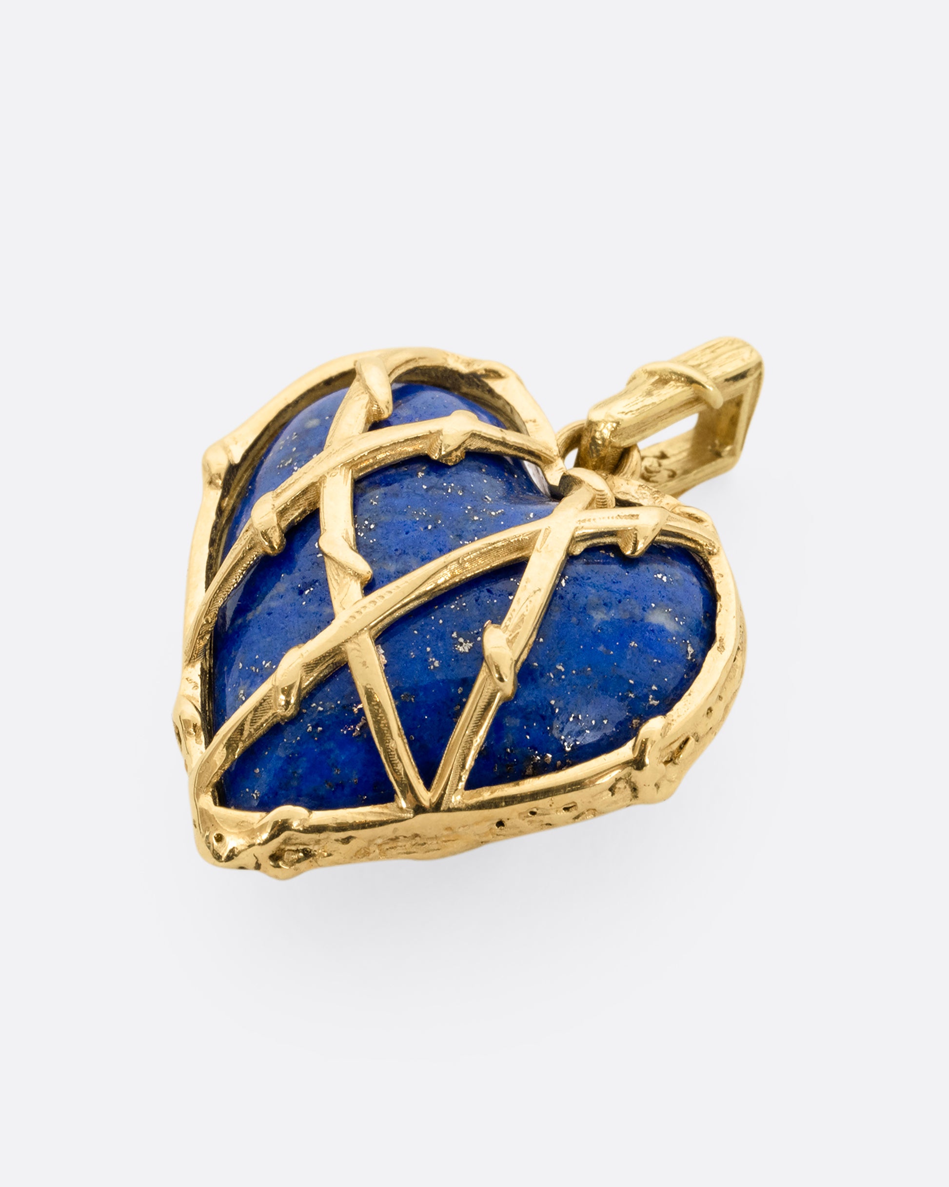 yellow gold heart shaped lapis charm shown lying flat