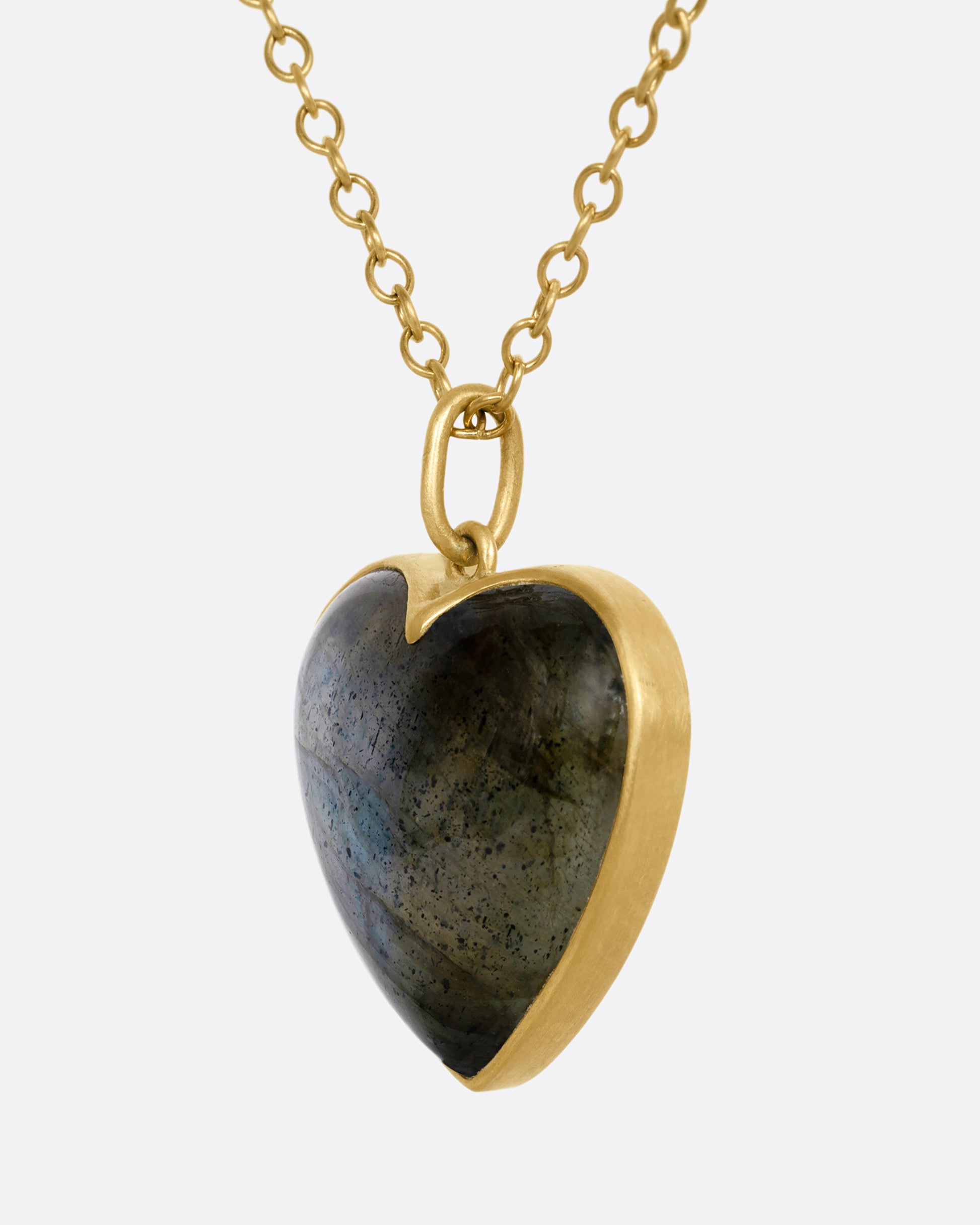 yellow gold necklace with a labradorite heart pendant shown from the side