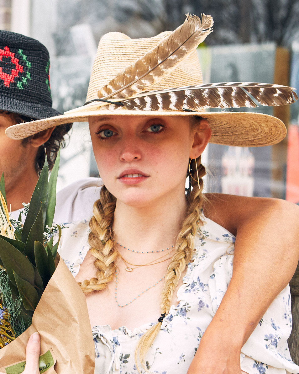 Called the bow hook earrings, this unusual shape is a unique take on a hoop earring with a flat edge that catches the light.