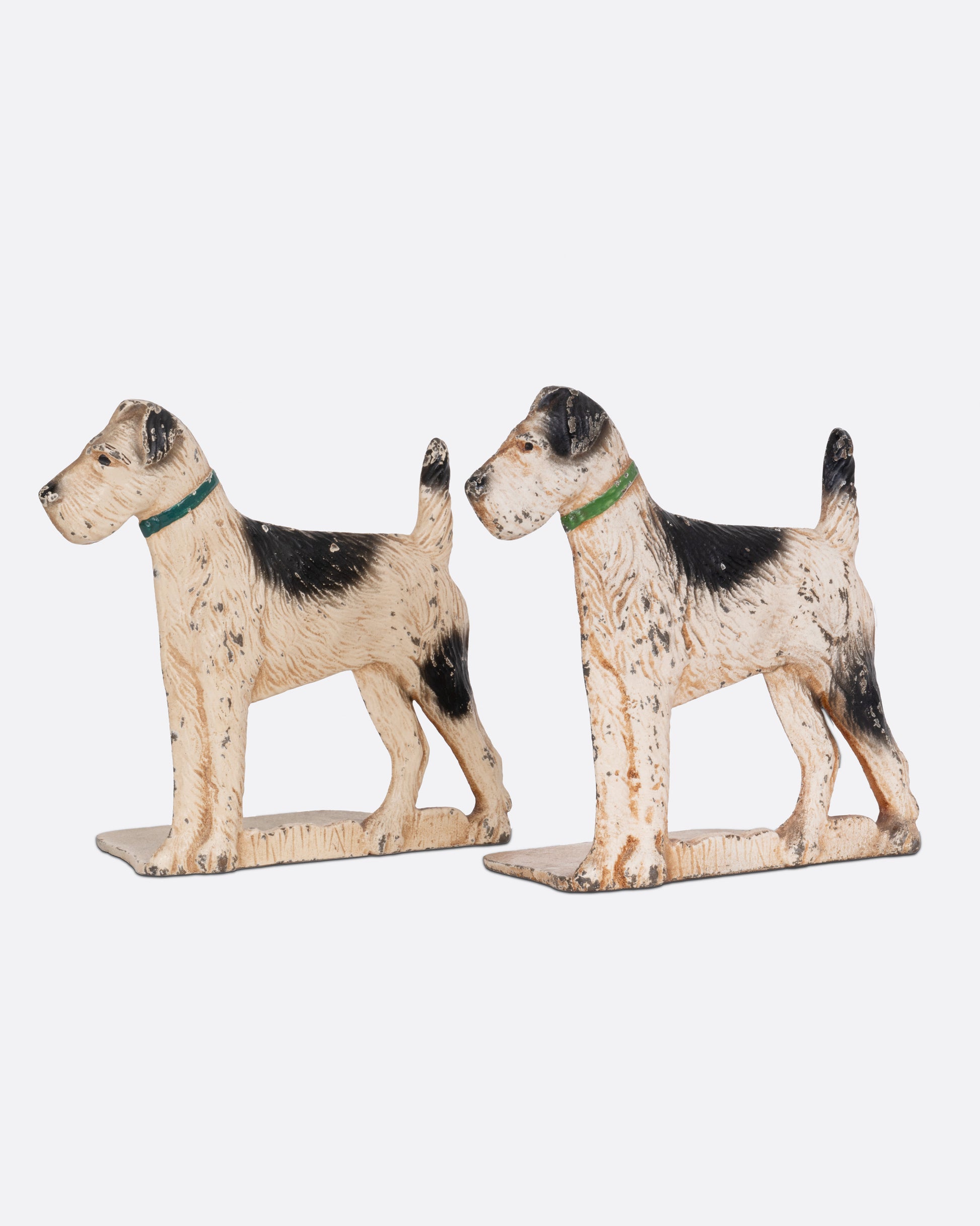 Two iron wire-haired fox terrier dog bookends, shown from the front.