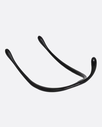 A black bronze wishbone sculpture, shown from the back.
