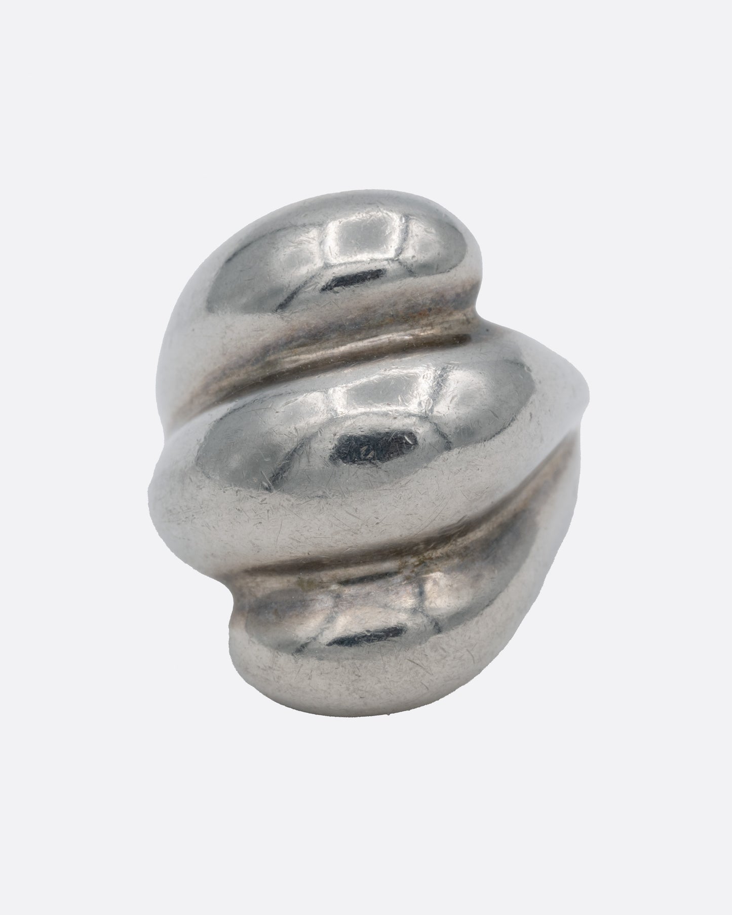 A silver ring with three domed tiers, shown from the front.