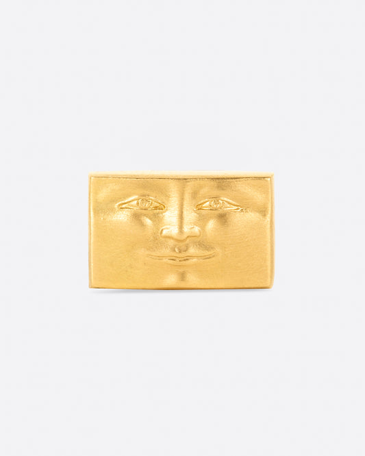 A tiny, smiling, rectangular face to adorn your ear.