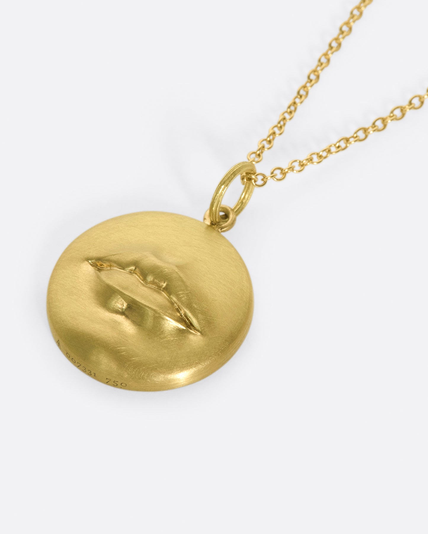 A solid, heavy pendant with a striking, sensual design with a sense of humor.