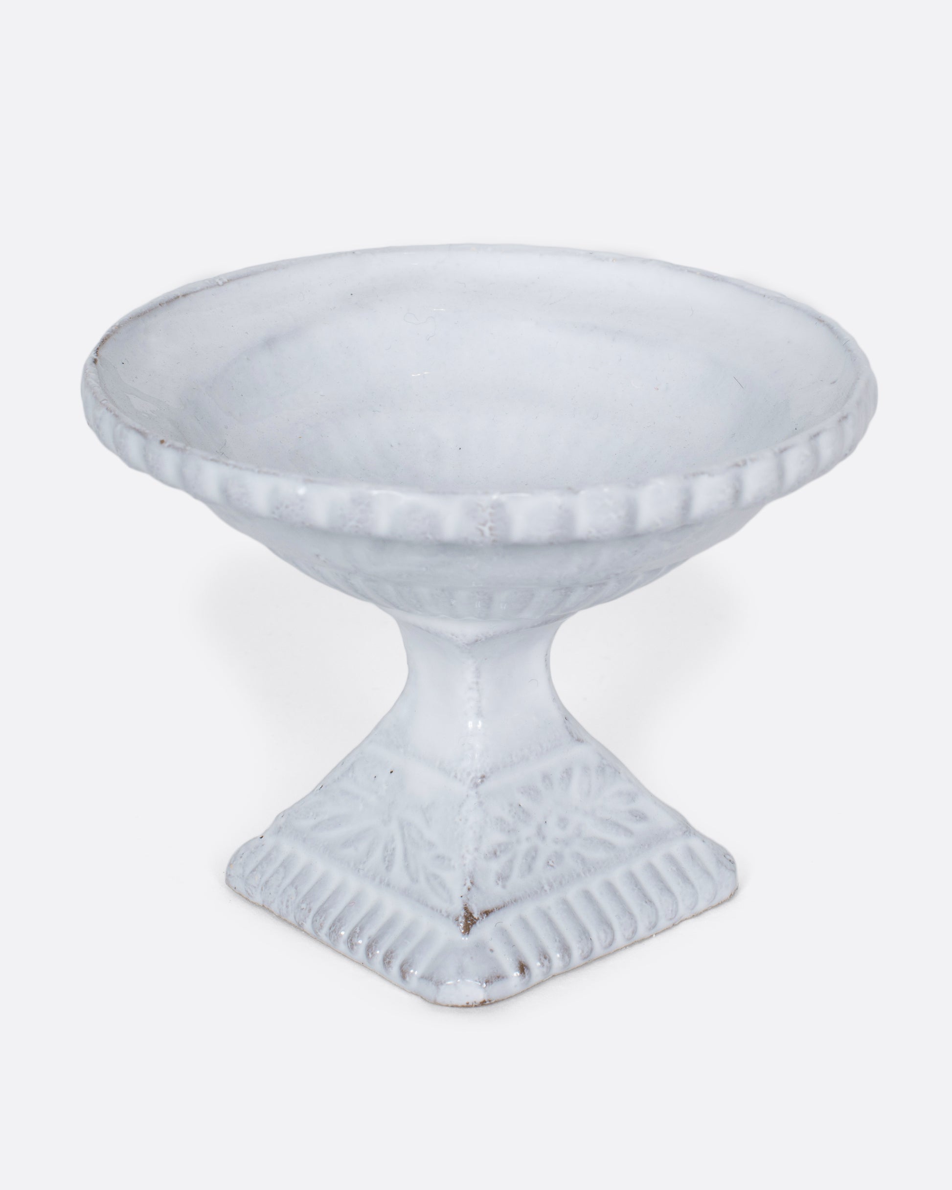 A handmade porcelain incense holder with a shiny white glaze. It looks like a Roman fountain, crafted for life in miniature, with a French-cool feel.