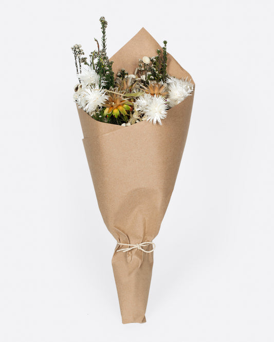 A dried bouquet greens, yellow and white.