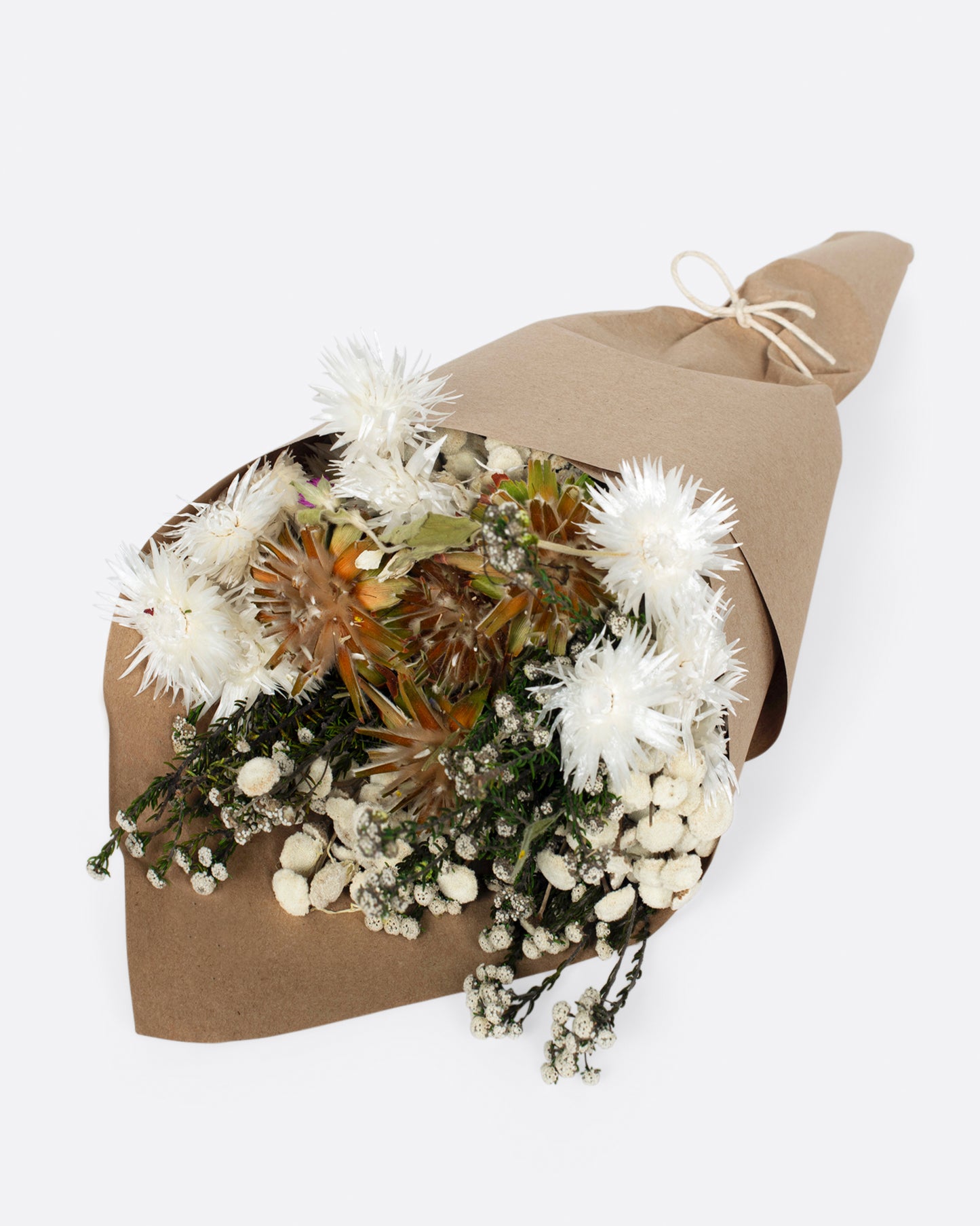 A dried bouquet greens, yellow and white.