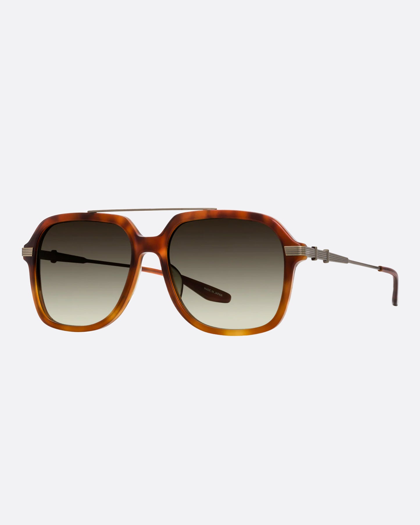 A pair of brown tortoise acetate aviator sunglasses with gold hardware and dark green lenses. Shown from the side.