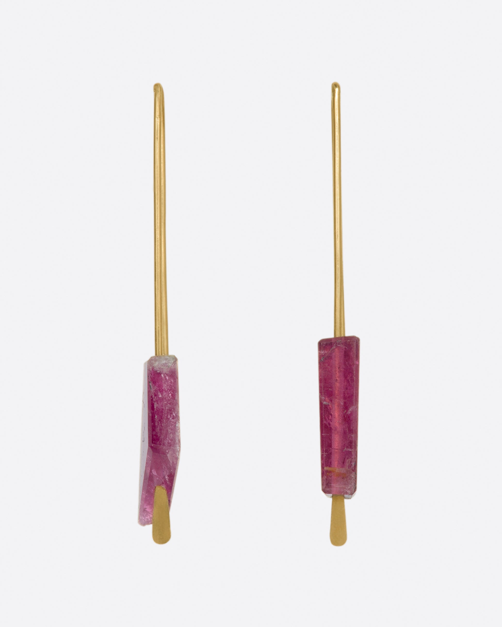 Yellow gold rectangular hook earrings with a single deep pink tourmaline on each. View from the front.