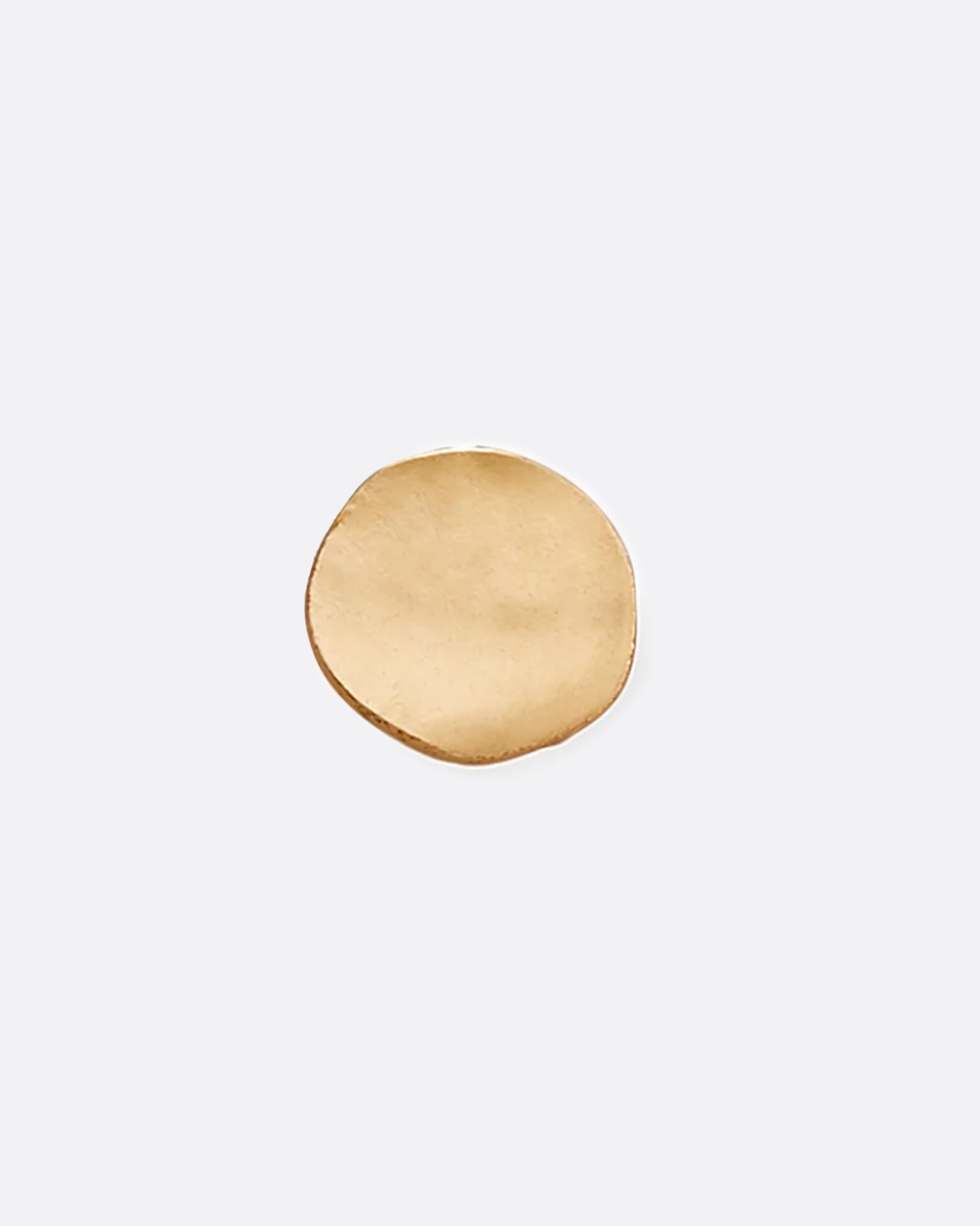 A yellow gold hammered dot stud earring.