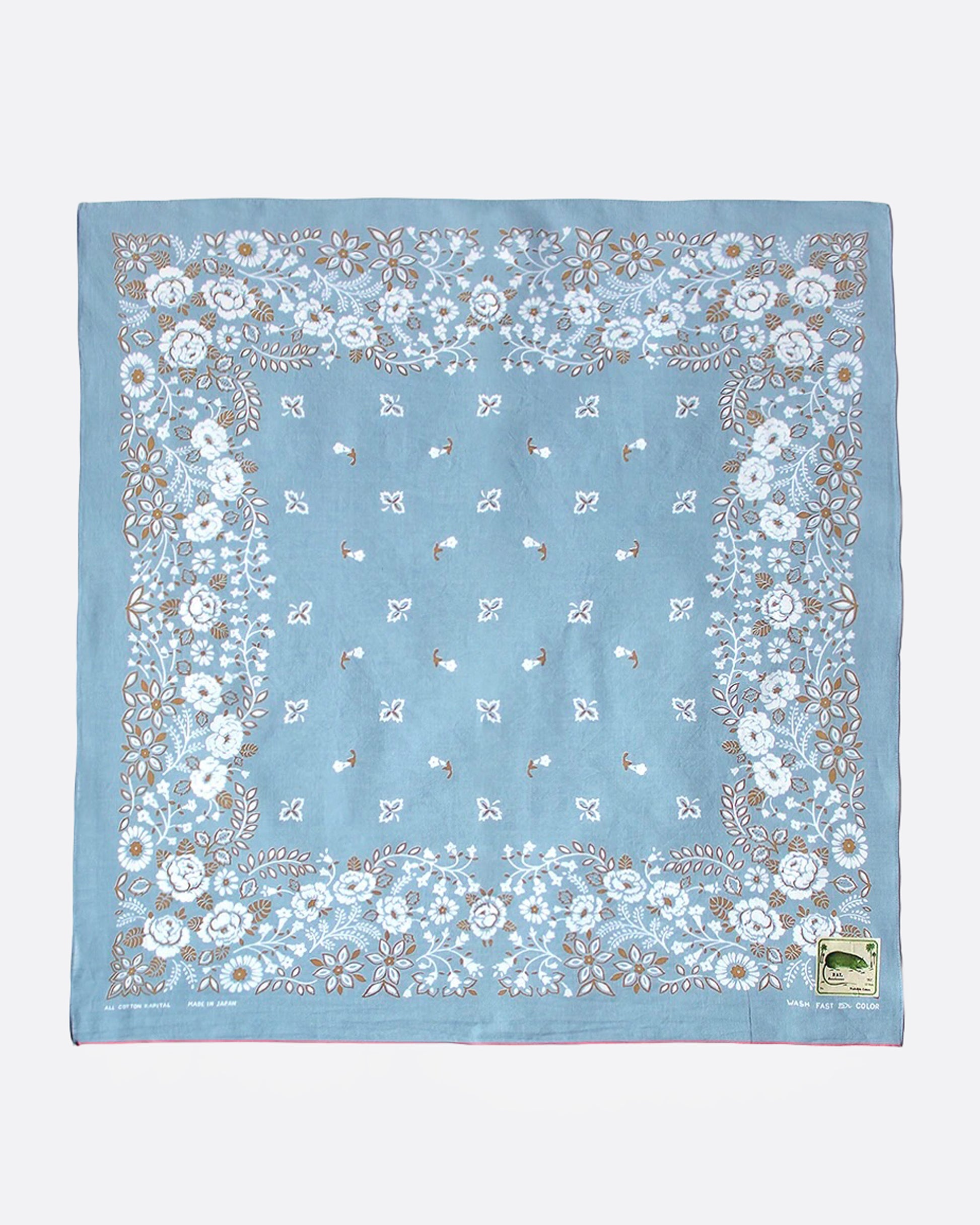 A blue bandana with a floral print, shown from the front.