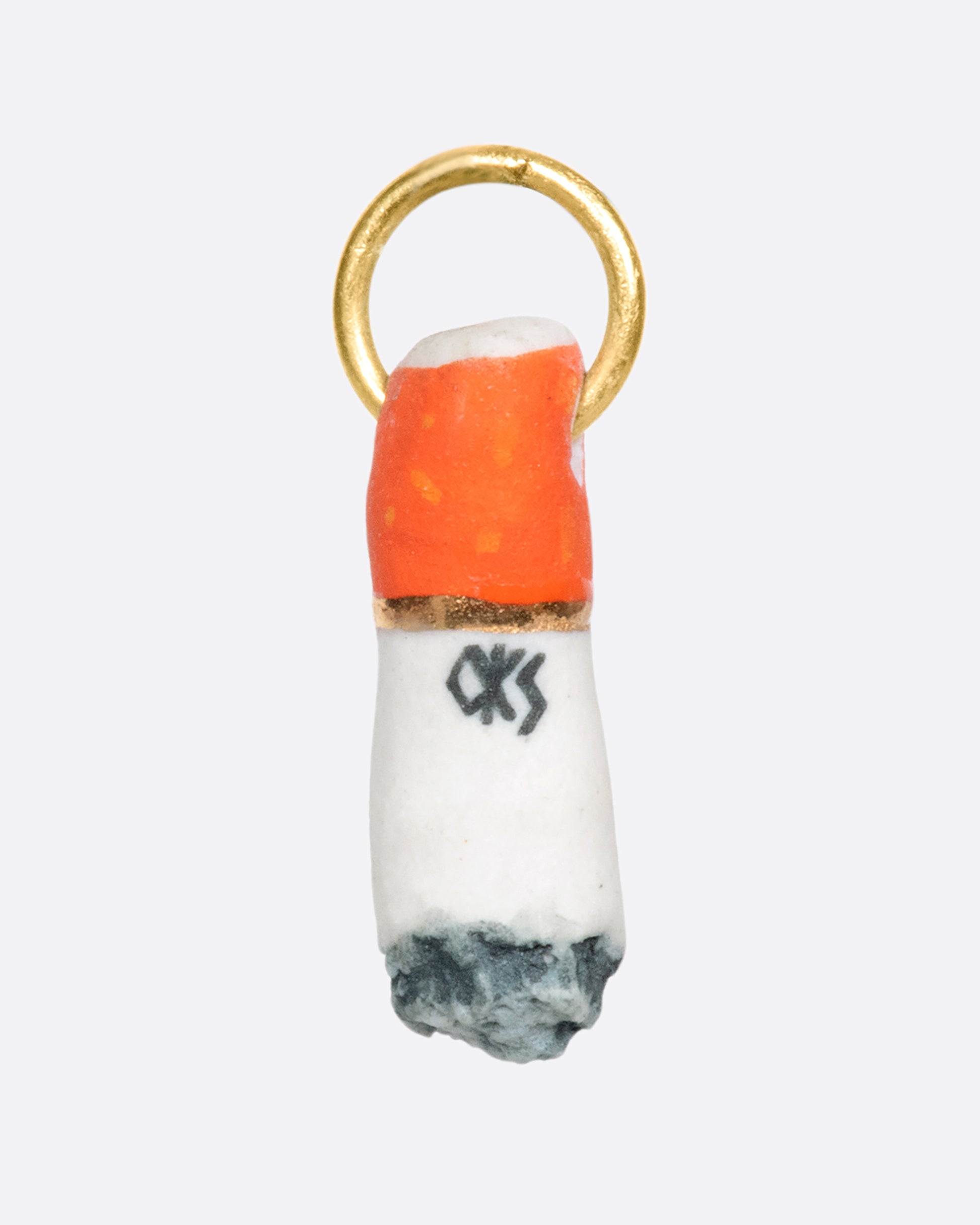 A half smoked, hand painted and glazed porcelain ciggy pendant