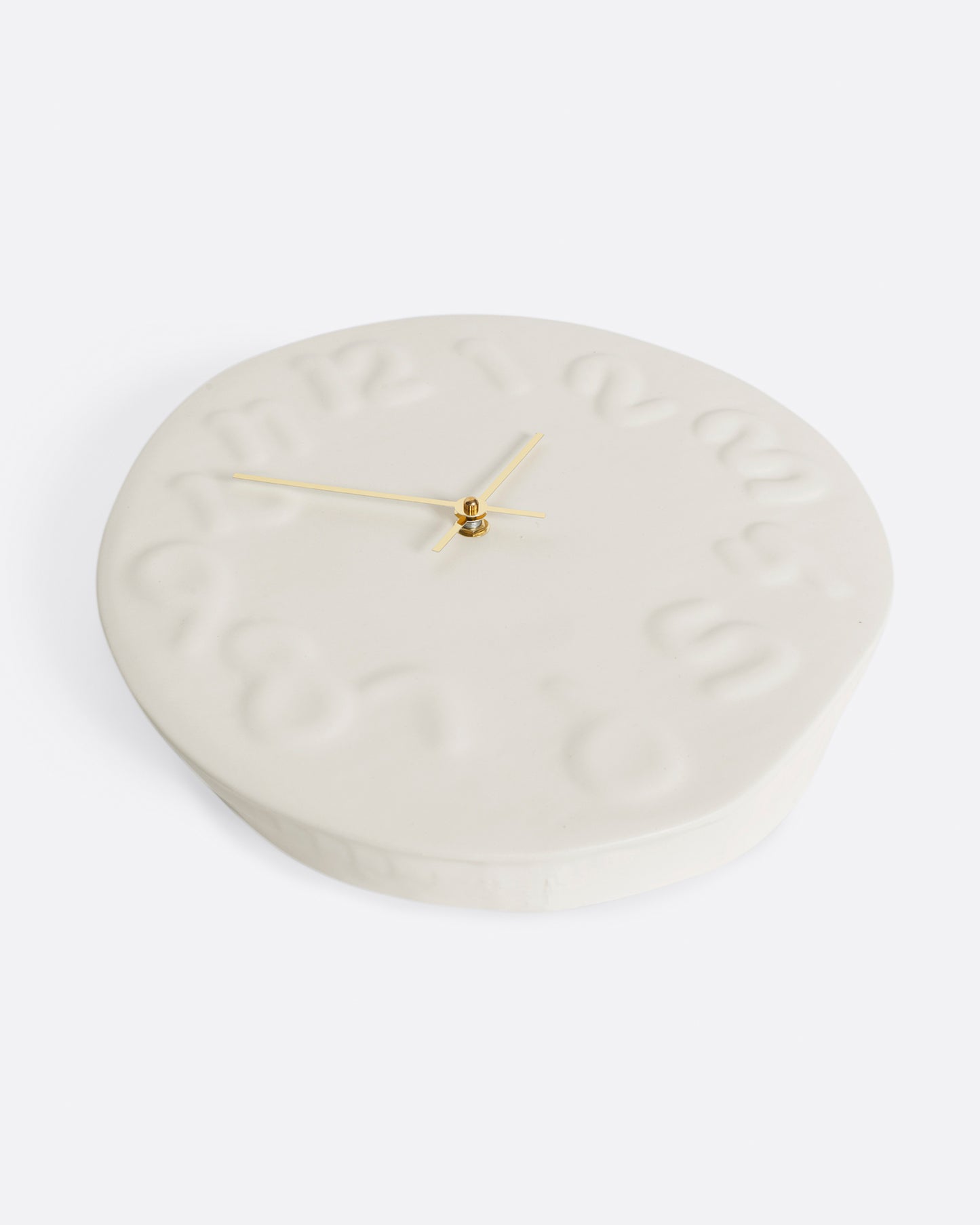 This handmade clock has brass hands and is a fun, yet subtle addition to any wall.