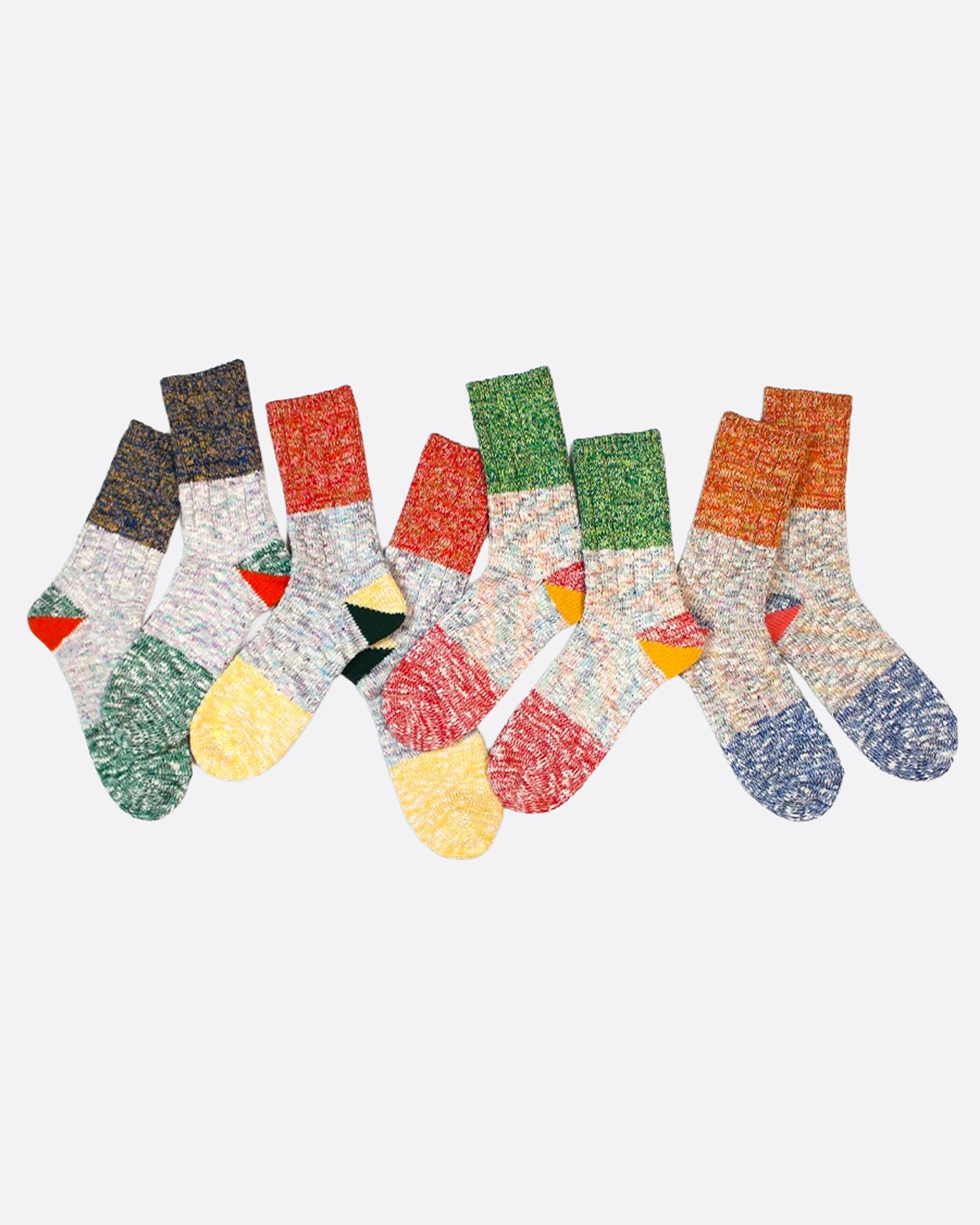 Four pairs of multicolored marl socks with dual-toned heels, shown from the side.