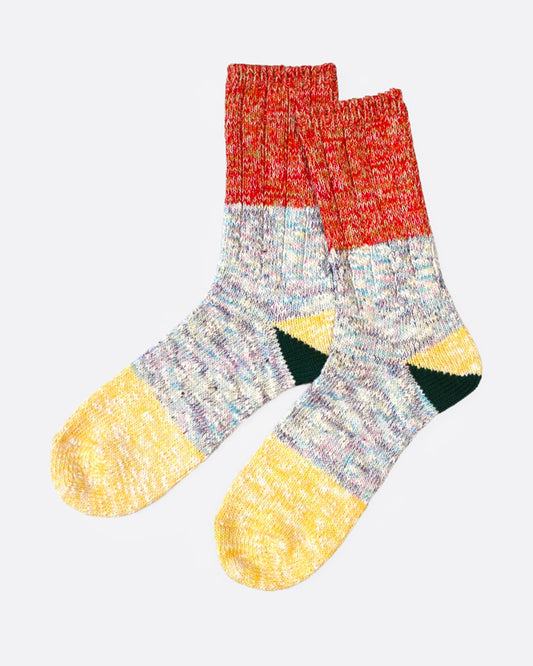 A pair of multicolored marl socks with dual-toned heels, shown from the side.