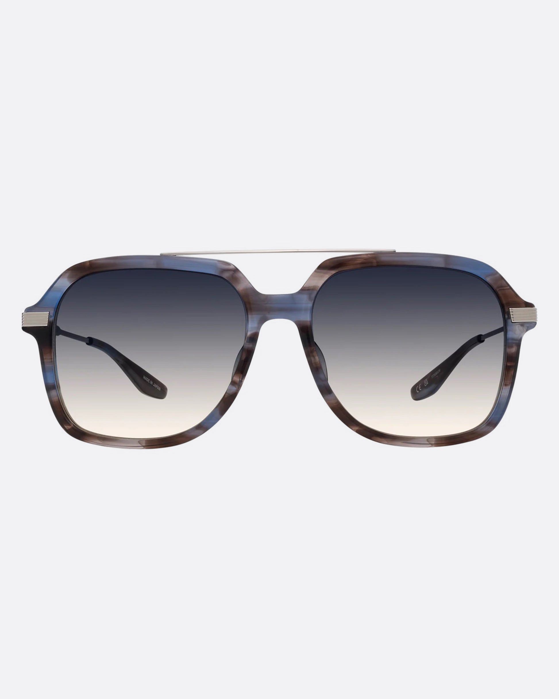 A pair of navigator sunglasses  with pearly blue and silver structured frames and gray gradient lenses. Shown from the front.