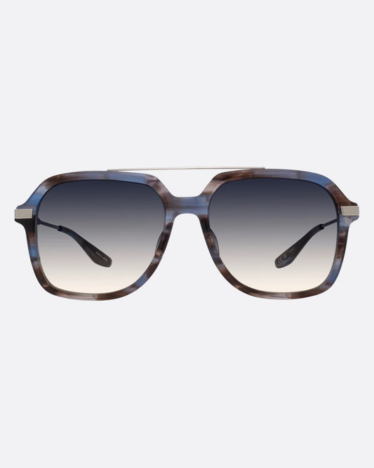A pair of navigator sunglasses  with pearly blue and silver structured frames and gray gradient lenses. Shown from the front.