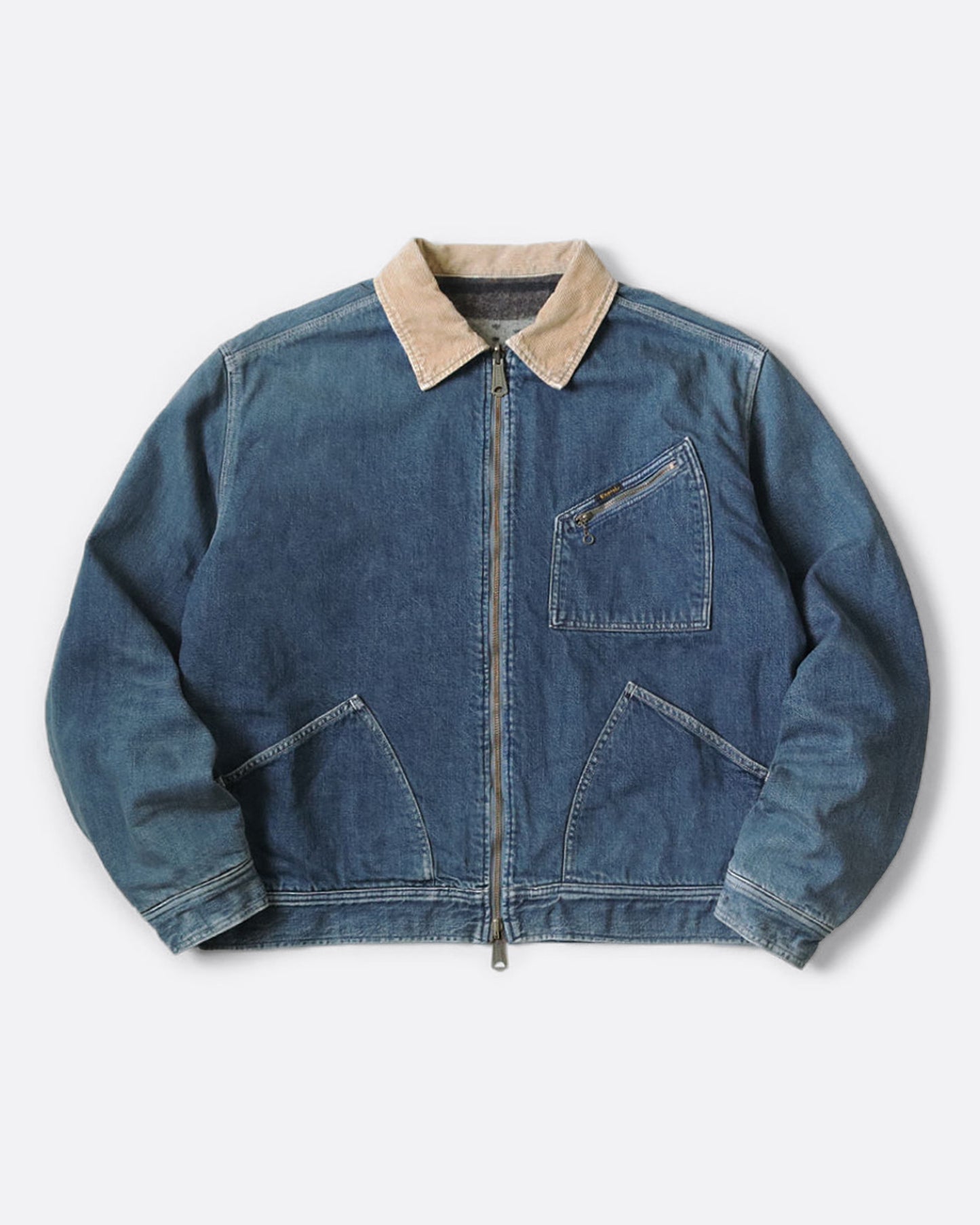 A blue denim work jacket with a beige collar and lined in wool with a skeleton print. Shown from the front.