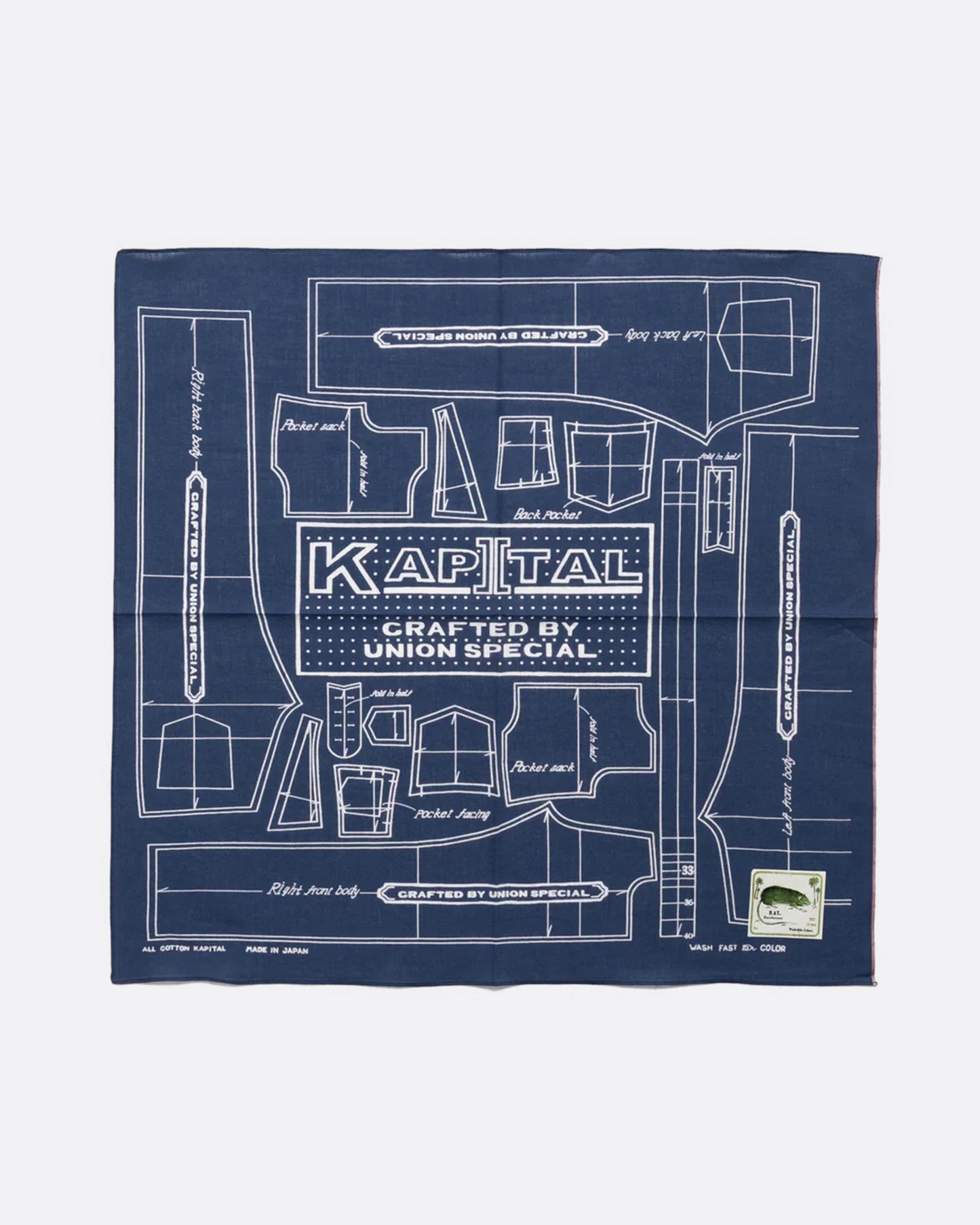 A navy cotton bandana with a  pattern for a Barbie sized outfit in white and 'KAPITAL CRAFTED BY UNION SPECIAL' at the center. Shown from the front.