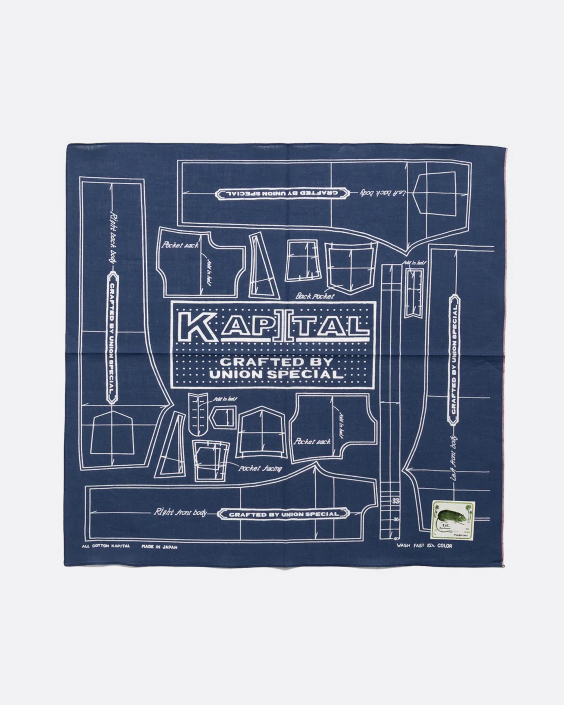 A navy cotton bandana with a  pattern for a Barbie sized outfit in white and 'KAPITAL CRAFTED BY UNION SPECIAL' at the center. Shown from the front.