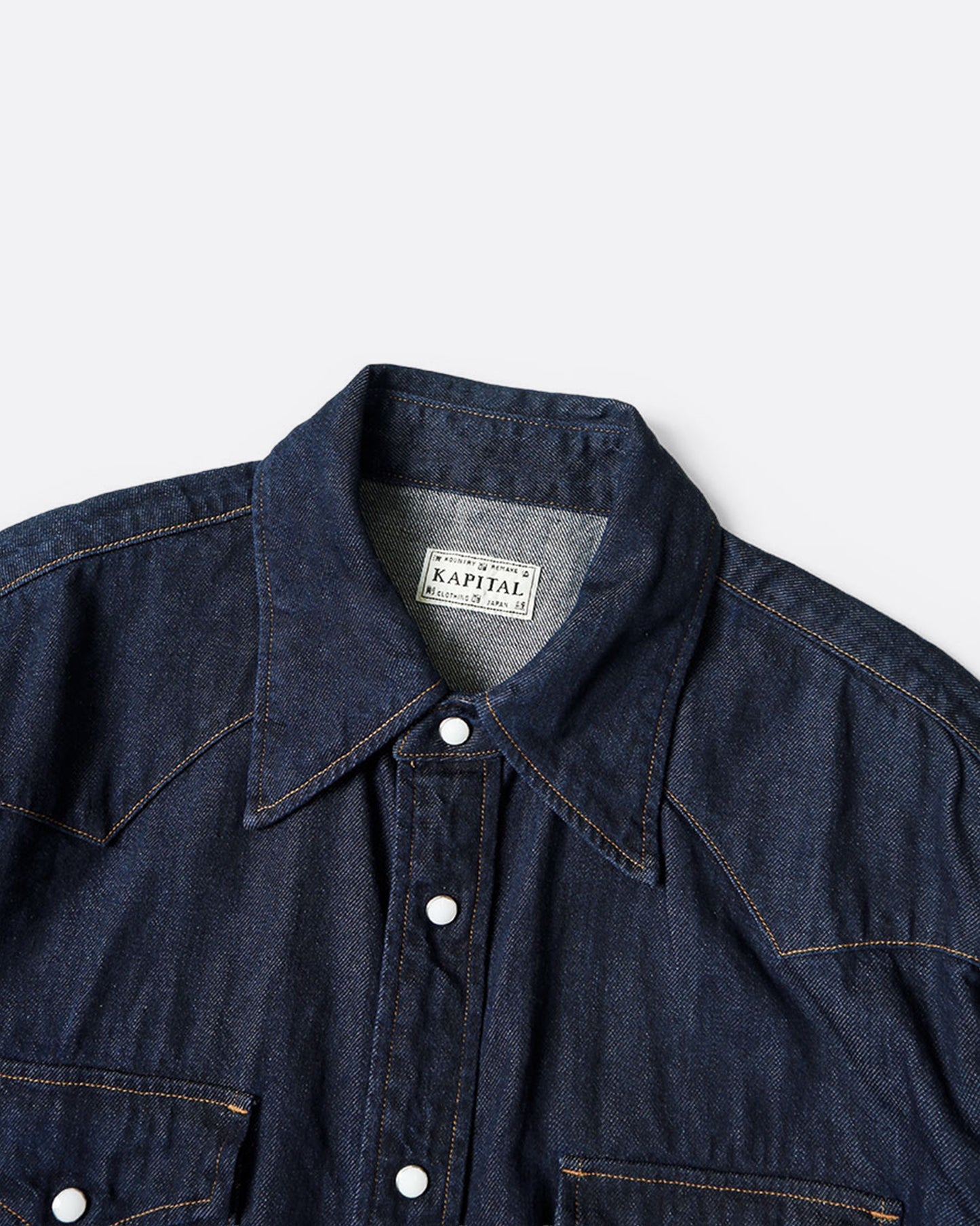 A Western shirt in deep indigo denim, shown from the front.
