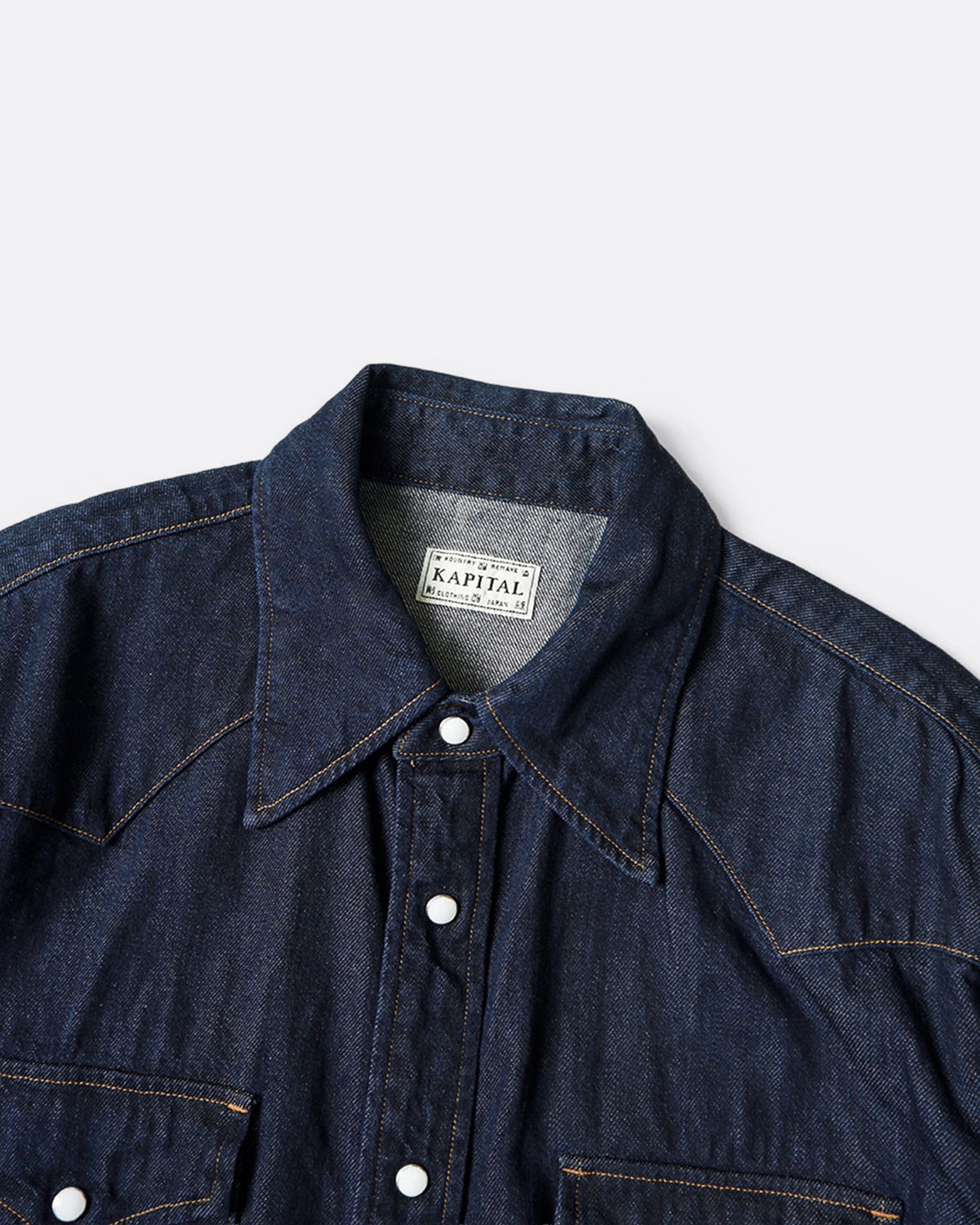 A Western shirt in deep indigo denim, shown from the front.
