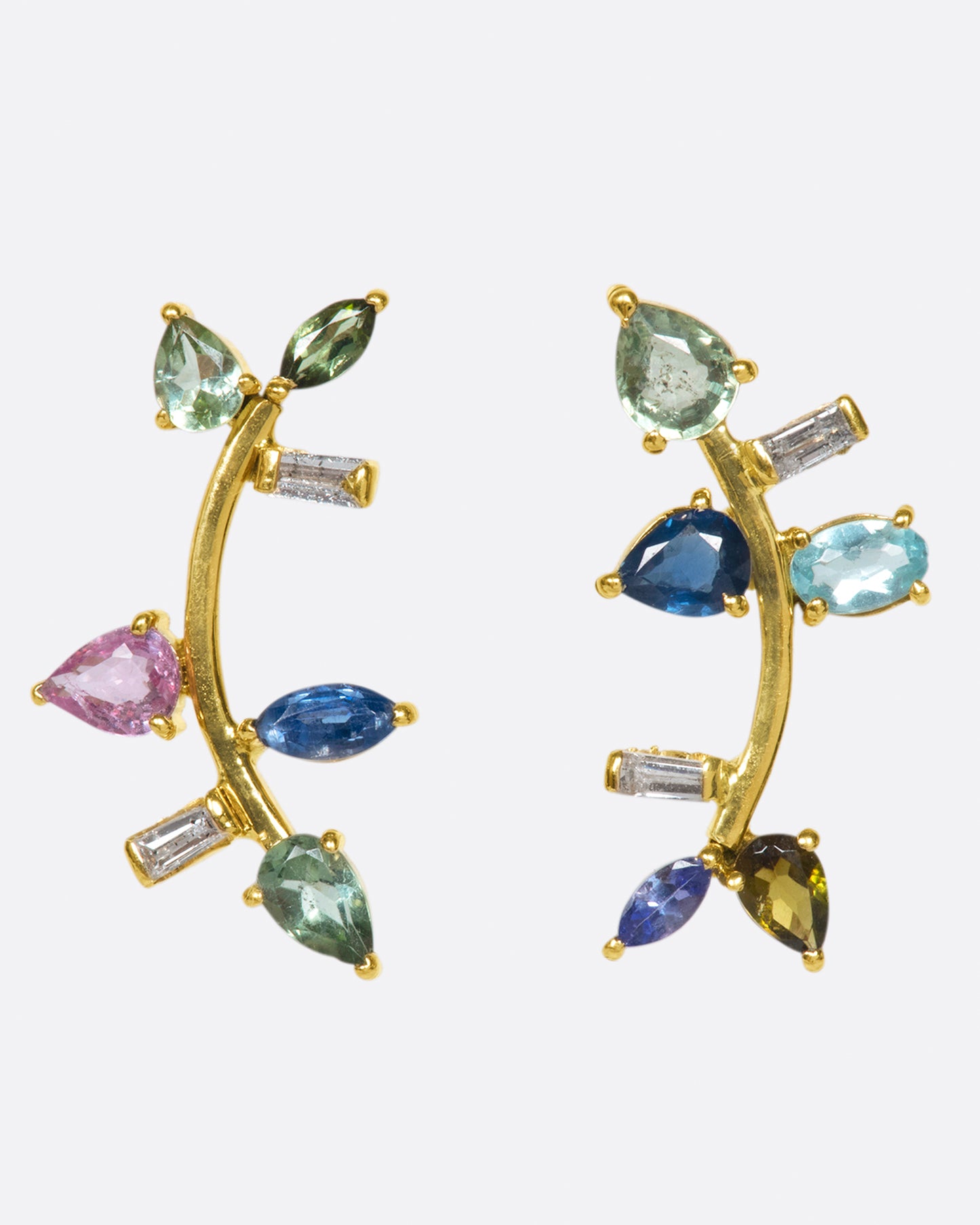 This elegant 14k gold stud, dotted with blue and green gemstones, reminds us of an olive branch