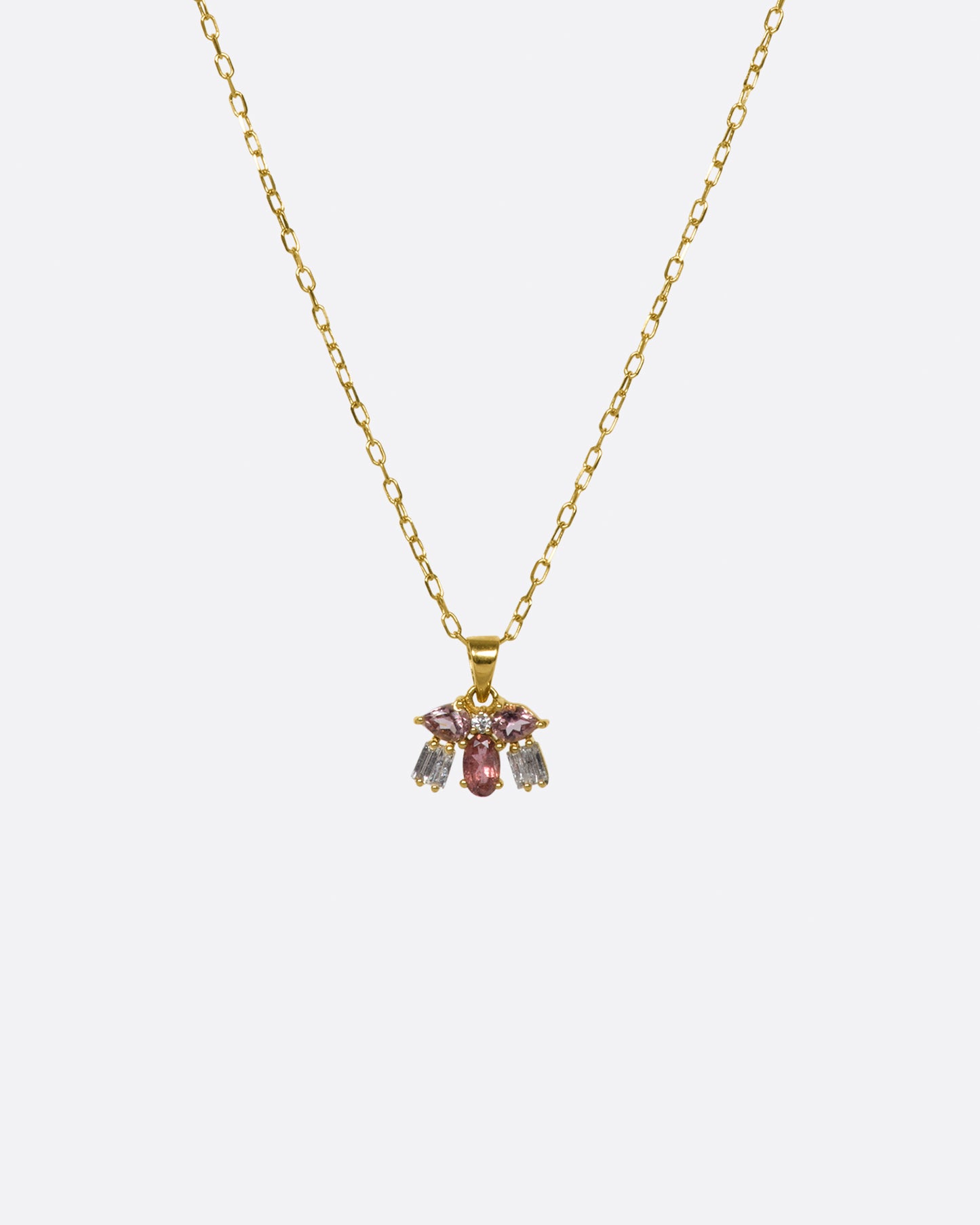 A tiny creature made from tourmalines and diamonds, hanging on a delicate chain.