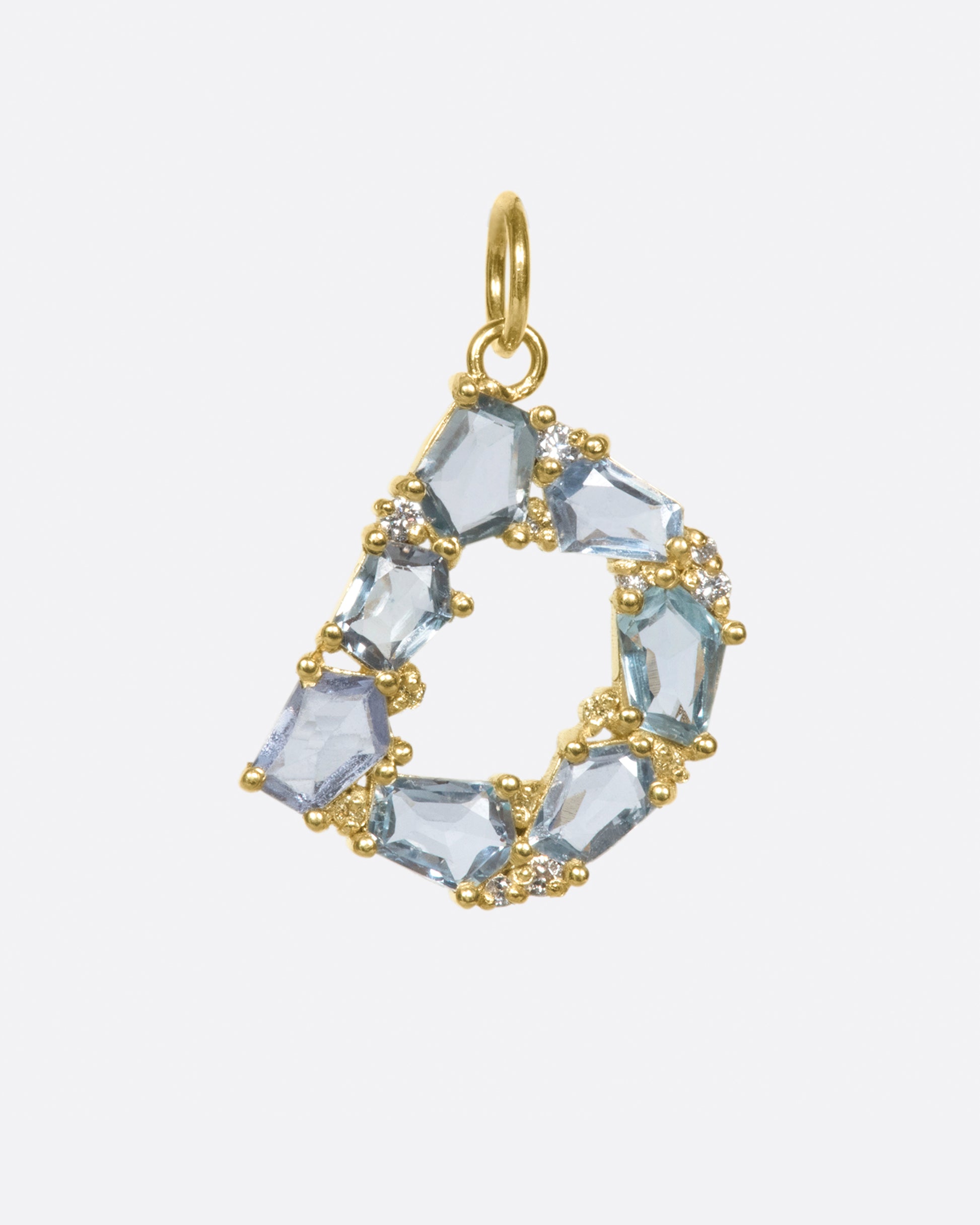 One of ERA's signature mosaic letter pendants, this time with light blue sapphires and diamonds.