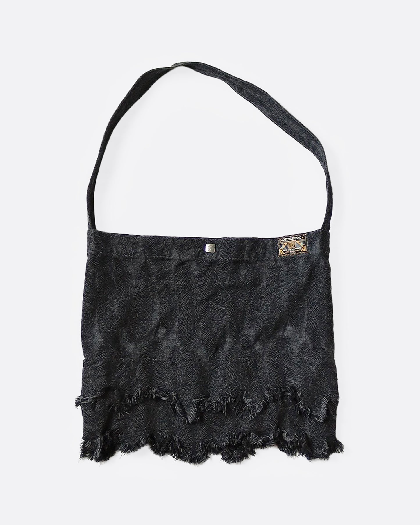 A jacquard denim bag with an all-over 3D feather motif and a cut-off hemline with a raw feathered seam. Shown from the front.
