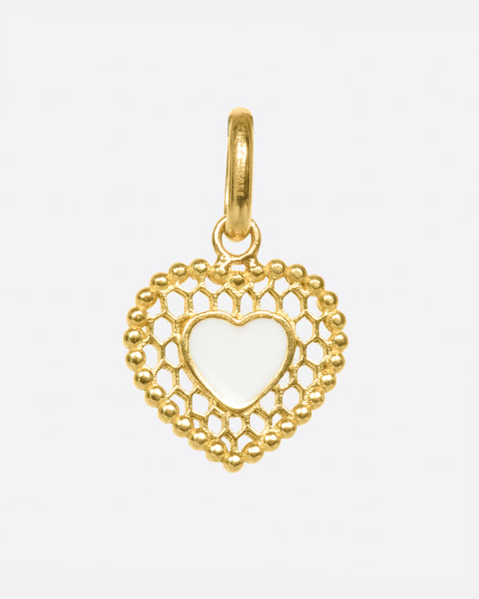 A vintage-inspired heart charm that's still cool and new with its cutout details.