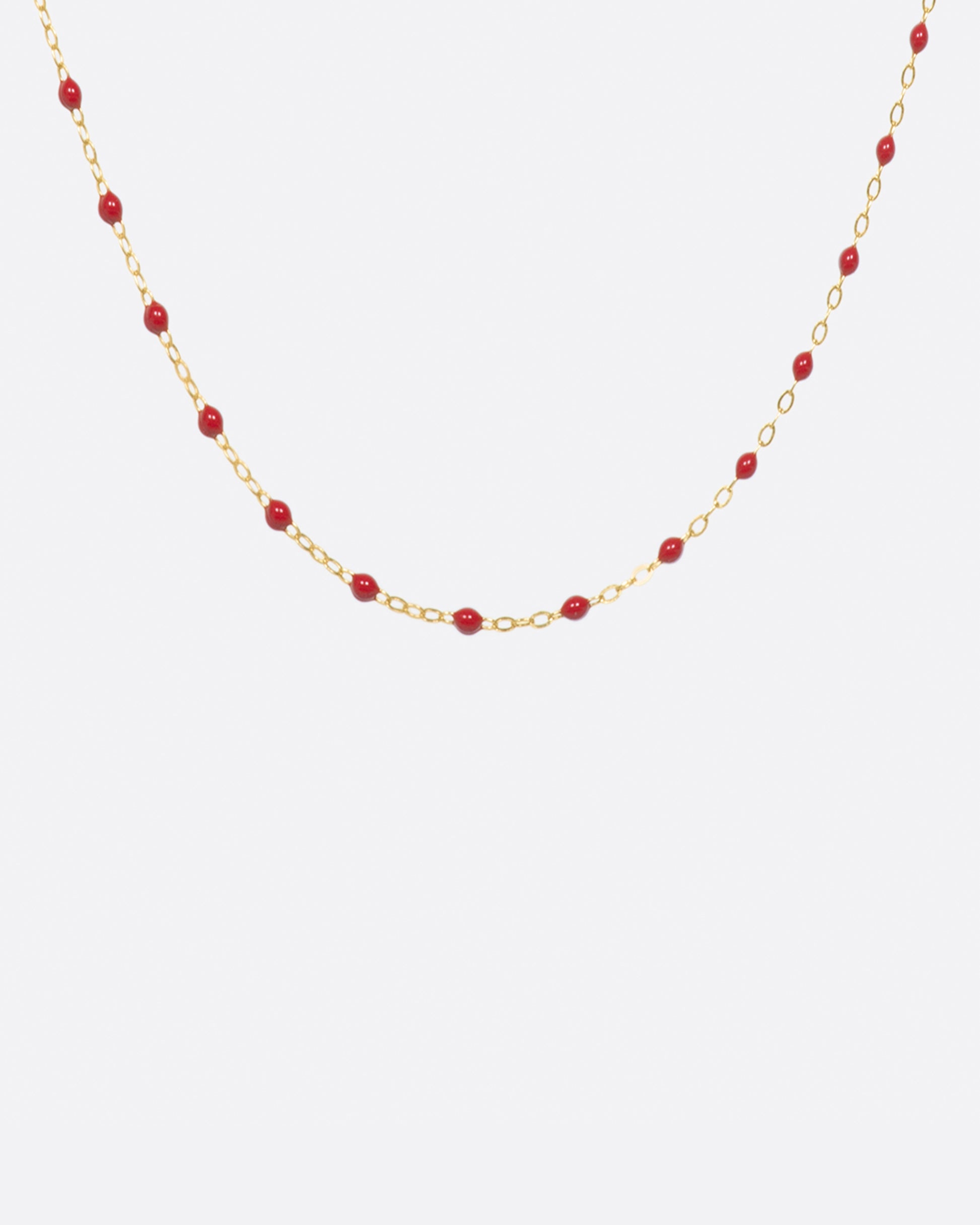 Thin 18k yellow gold chain necklace with resin beads, shown in a 16 inch length