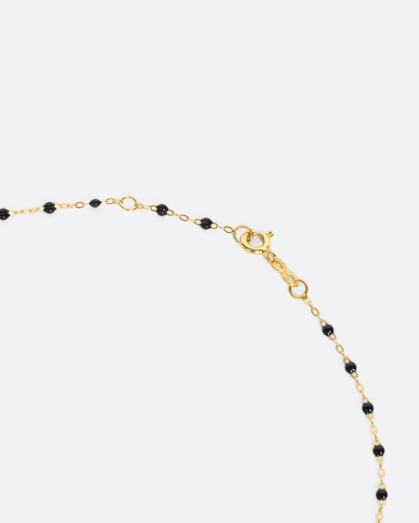 Thin 18k yellow gold chain necklace with resin beads. Each necklace is hand dipped in melted resin to create the beaded effect. 