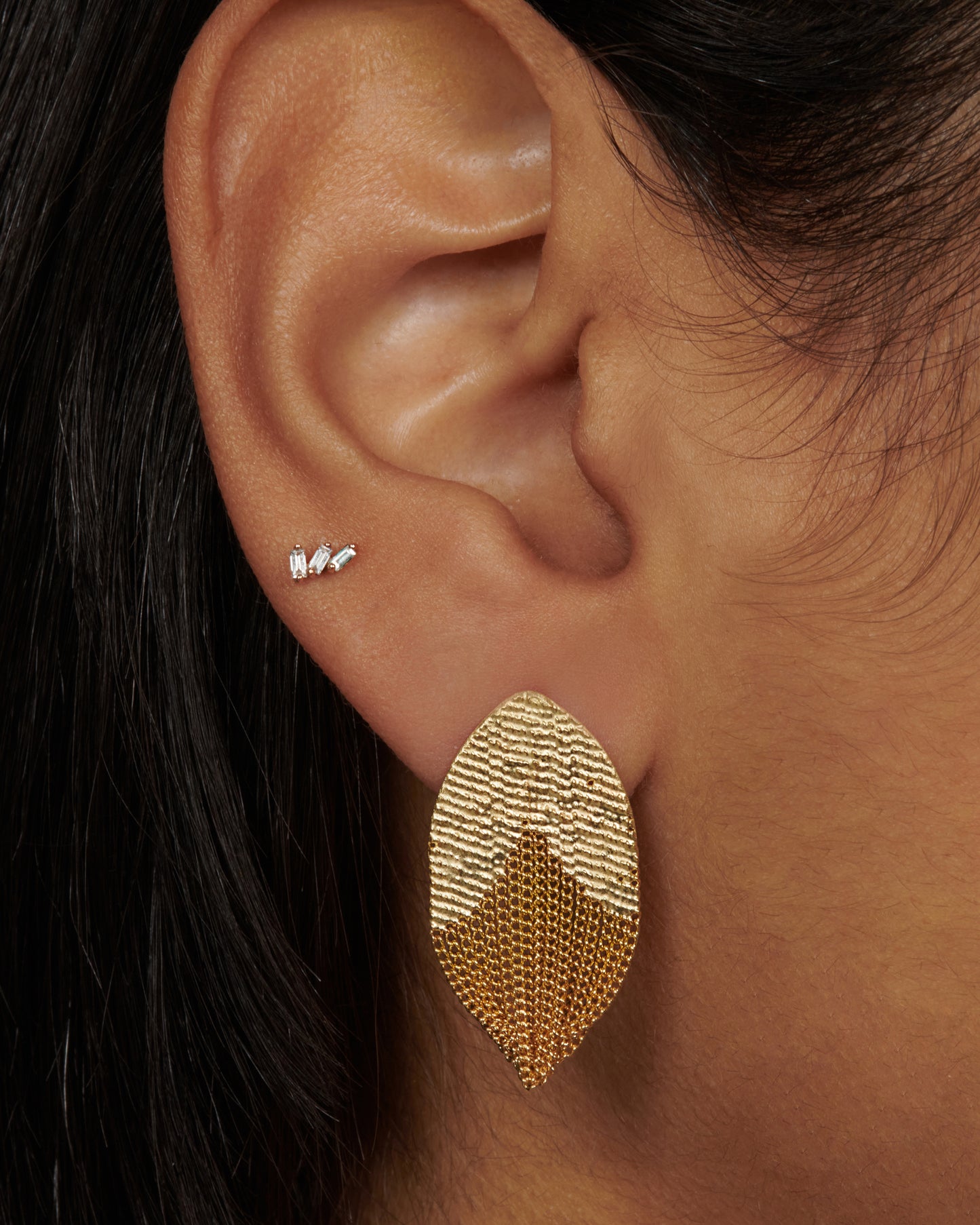 A pair of tulip inspired earrings crafted out of 18k yellow gold chains