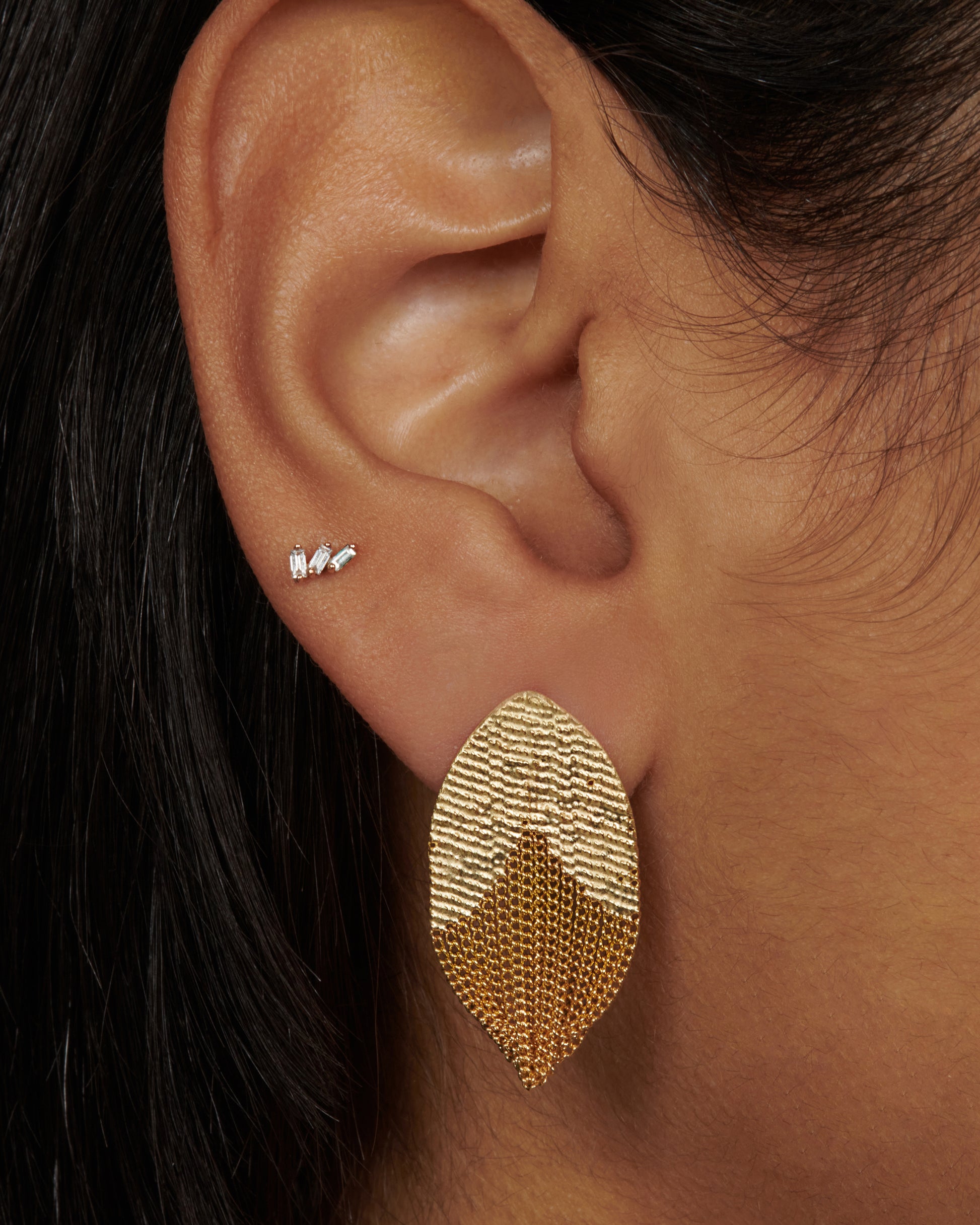 A pair of tulip inspired earrings crafted out of 18k yellow gold chains