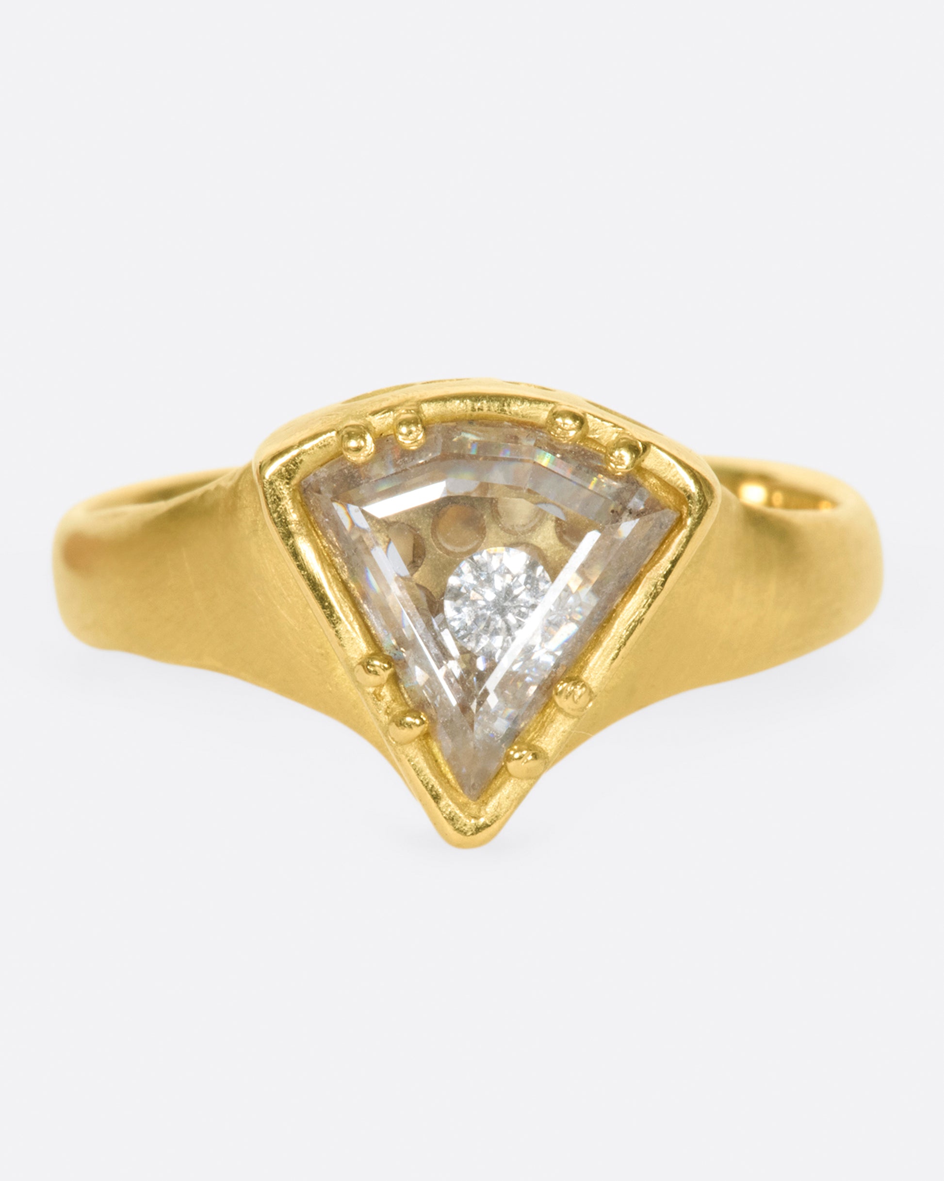 A shaker ring with a white diamond slice enveloping a cache of tiny diamonds