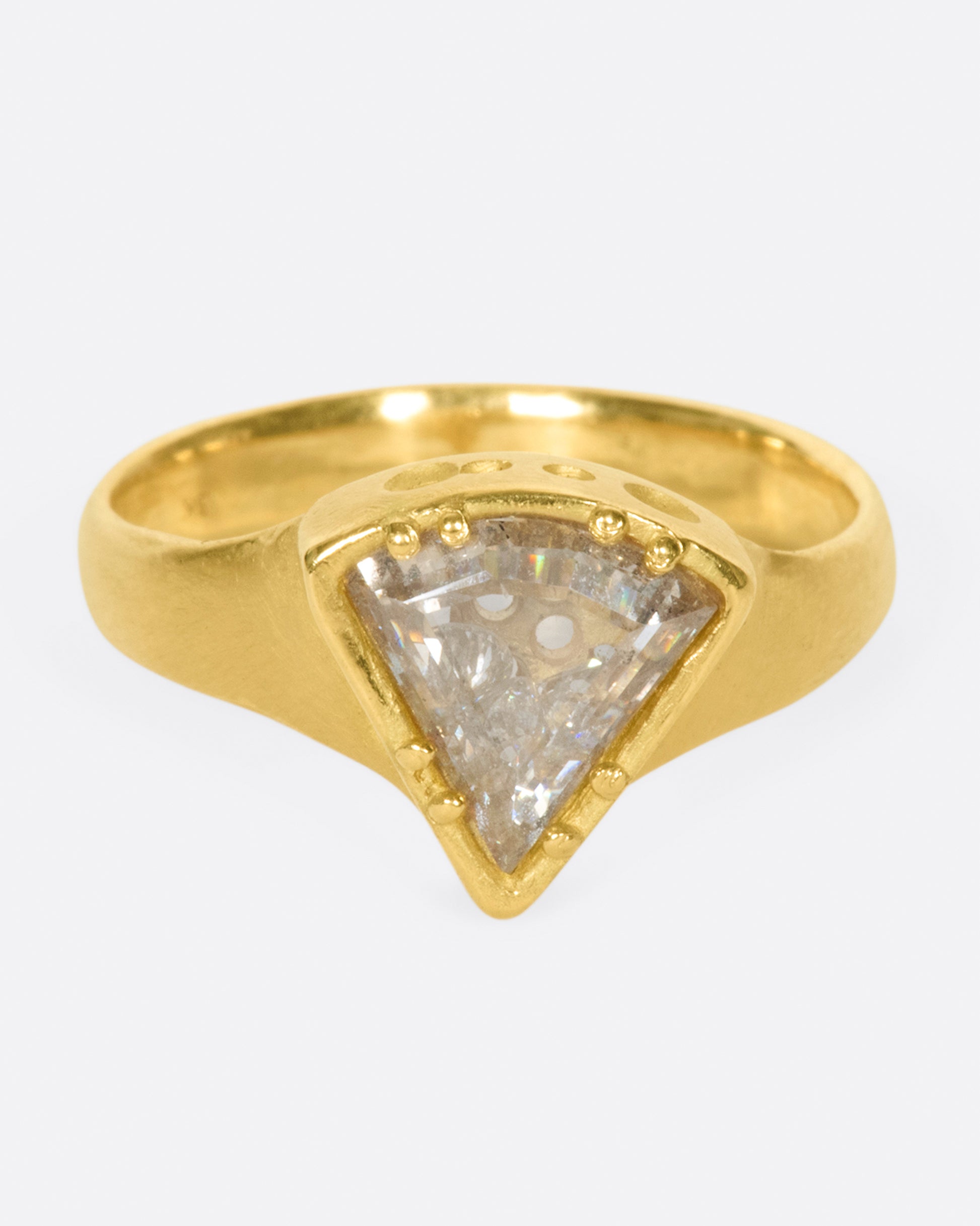 A shaker ring with a white diamond slice enveloping a cache of tiny diamonds